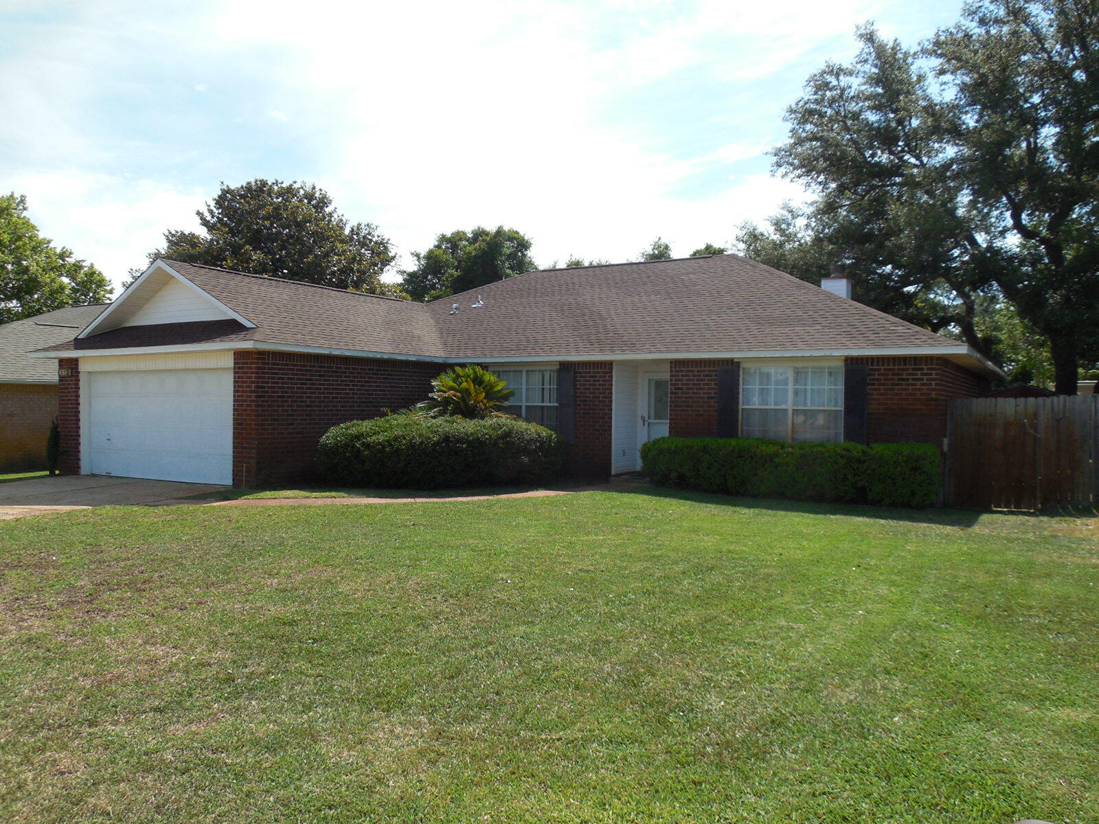 Don't miss this nice home nestled in the serene waterfront subdivision of Sandy Beach Estates. Just minutes from Hurlburt Field, this 3-bedroom, 2-bathroom home offers a generous 1,706 square feet of open living space and a large 2-car garage. Inside, you will find a bright, freshly painted interior, complemented by a brand-new roof and newly installed HVAC system, ensuring your comfort and peace of mind. The spacious living area is perfect for relaxing with family or entertaining friends, with vaulted ceilings and a cozy fireplace that appears to have never been used. Sliding glass doors provide access to your private outdoor space with a fully fenced back yard. The kitchen is equipped with all the necessary essentials and opens up to a cozy dining area, making mealtime a breeze. With a split floor design, you can enjoy a private master suite where you'll find a large walk-in closet and a well-appointed in suite bathroom. On the other side of the house, you will find the laundry room, 2 additional bedrooms and a nice size full bathroom adding to the home's functionality.
Nature enthusiasts will love the common outdoor space, which features a picnic area, gazebo, and dock access, perfect for fishing or just enjoying the scenic waterfront views. Whether you're an outdoor adventurer or simply seeking a tranquil, inviting space to call home, this property offers the best of both worlds. Don't miss out on this opportunity to own your slice of paradise in the waterfront subdivision of Sandy Beach Estates. Please call or text Chuck Roland at (850)685-2418 to schedule an appointment to view this home