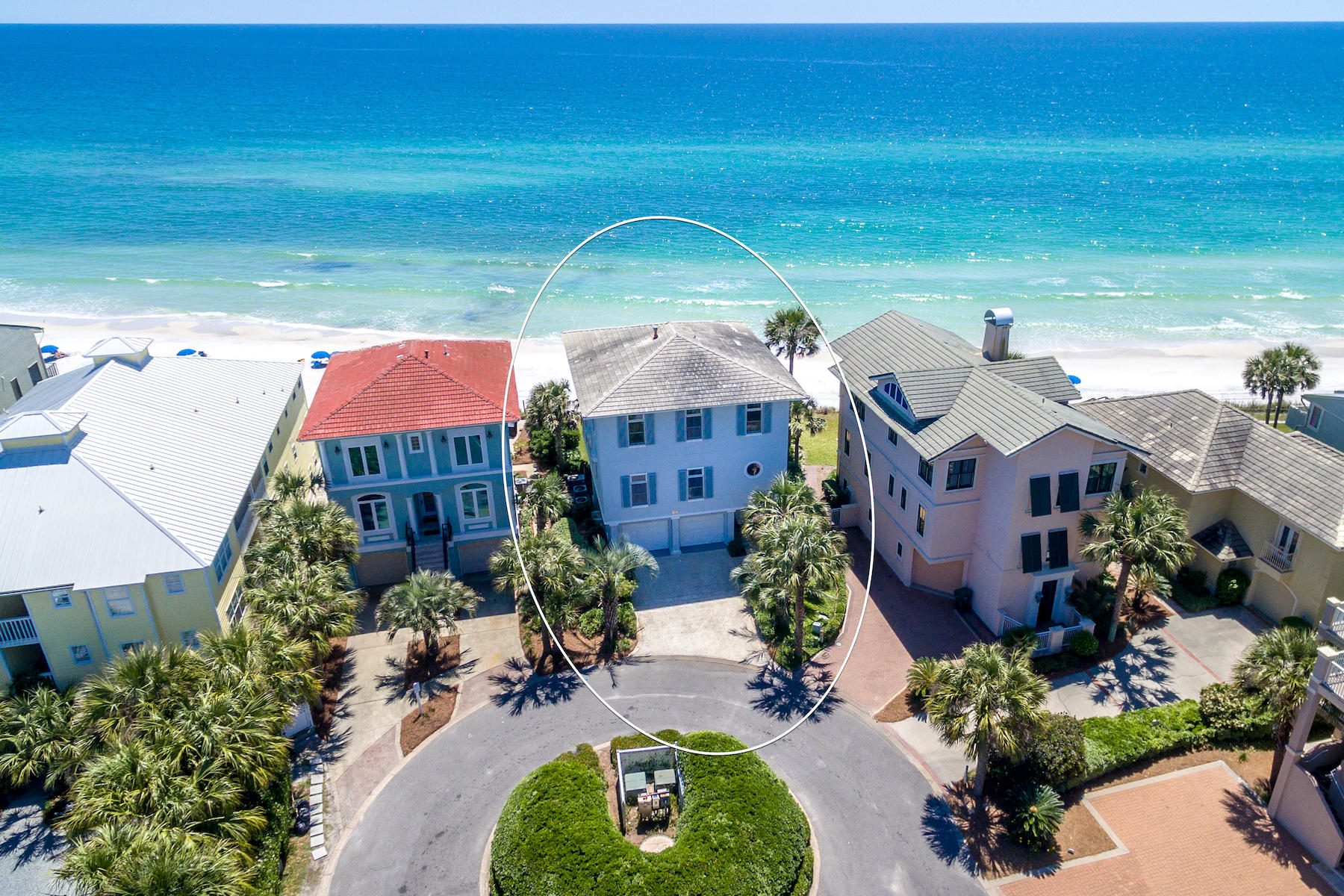 Found in the heart of Blue Mountain Beach, this expansive, Gulf-front beach house offers 4 spacious suites, a bonus bunk room, and coveted outdoor entertainment spaces with turquoise views that dreams are made of. This three-story home can be found south of Scenic 30A on a quiet cul-de-sac of the Grande Beach community. Offering a welcoming covered front porch and a spacious foyer, this home was made to entertain guests with separate guest quarters that can be accessed through the home's expansive two car garage. Guests will enjoy an expansive one bedroom suite, a bonus bunk room and direct access to the home's lush beach-front green space and the sugar white-sand beaches of 30A. The second level of the home features an open concept great room meant for gathering, featuring a soaring coffered ceiling and tile floors. Breathtaking Gulf views can be enjoyed from each level of the home. Featuring large windows with transom lights, the open sunlit living room features a built in entrainment center and gas fireplace. The kitchen offers a large island with a breakfast bar, ample storage space and a dining room that features seating for six. On the second level you can also find a Captain's study with vaulted ceilings, wood floors and rustic wood paneling that adds a quaint beach cottage feel, as well as, a full bath that's perfect for guests, a large laundry room with generous workspace, and a convenient dumbwaiter. Enjoy the spacious back deck with cozy outdoor furniture perfect for enjoying the scenic sunset views. The third level presents a spacious master suite with soaring coffered ceilings and large windows with transom lights that present Gulf views as far as the eye can see. Featuring a large walk-in closet and built in storage, no detail has been overlooked in creating this beach front retreat. The large master bath offers dual vanities, a spacious shower with two shower heads, a private water closet and jetted tub featuring scenic emerald views that offers the perfect place to unwind. Enjoy the soothing sounds of the Gulf from the master bedroom's covered balcony. Also on this level, there are two additional bedrooms, each with adjoining baths. This home presents automated custom storm shutters as an additional defense against the Gulf winds and is being sold furnished. The beach can be at your backdoor! Grande Beach is a beach front community located south of Scenic 30A in the heart of Blue Mountain Beach that is convenient to all of the luxuries of life along 30-A and offers a private community pool. This home makes a perfect primary residence, second home or investment property with appreciation likely.