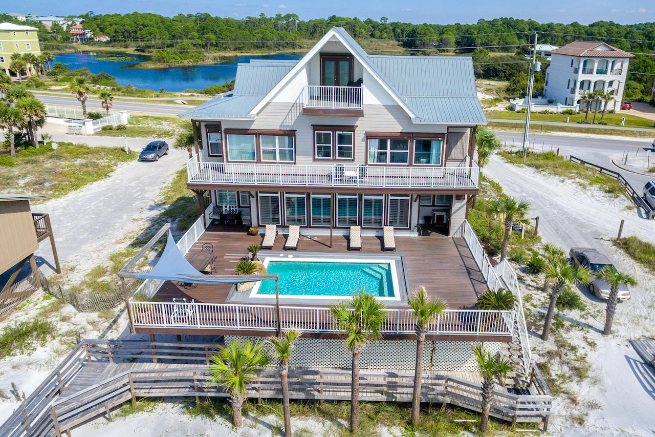 Looking for a well maintained home with expansive GULF VIEWS at a reasonable price? A WELL DESIGNED FLOOR PLAN with forever GULF VIEWS and COASTAL DUNE LAKE VIEWS, over a large HEATED POOL with AMPLE SPACE for friends and family to gather, is a home to see. This impressive 4 story beach home is located on the South Side of Scenic Corridor 30A with close proximity to Grand Blvd. and Destin. With 6 bedrooms/flex space,4 Full Baths, 2 CAR GARAGE, RV HOOK-UP & still more parking. The house has been TOTALLY RENOVATED and decorated with an established rental income of just under $200,000/year, in place. NEW HVAC and NEW ROOF 2018.There is MORE: The property adjacent to the east is owned by the County and cannot be built on! This means forever views & breezes without obstruction. Being sold FULLY FURNISHED, with a list of exclusions available upon request.