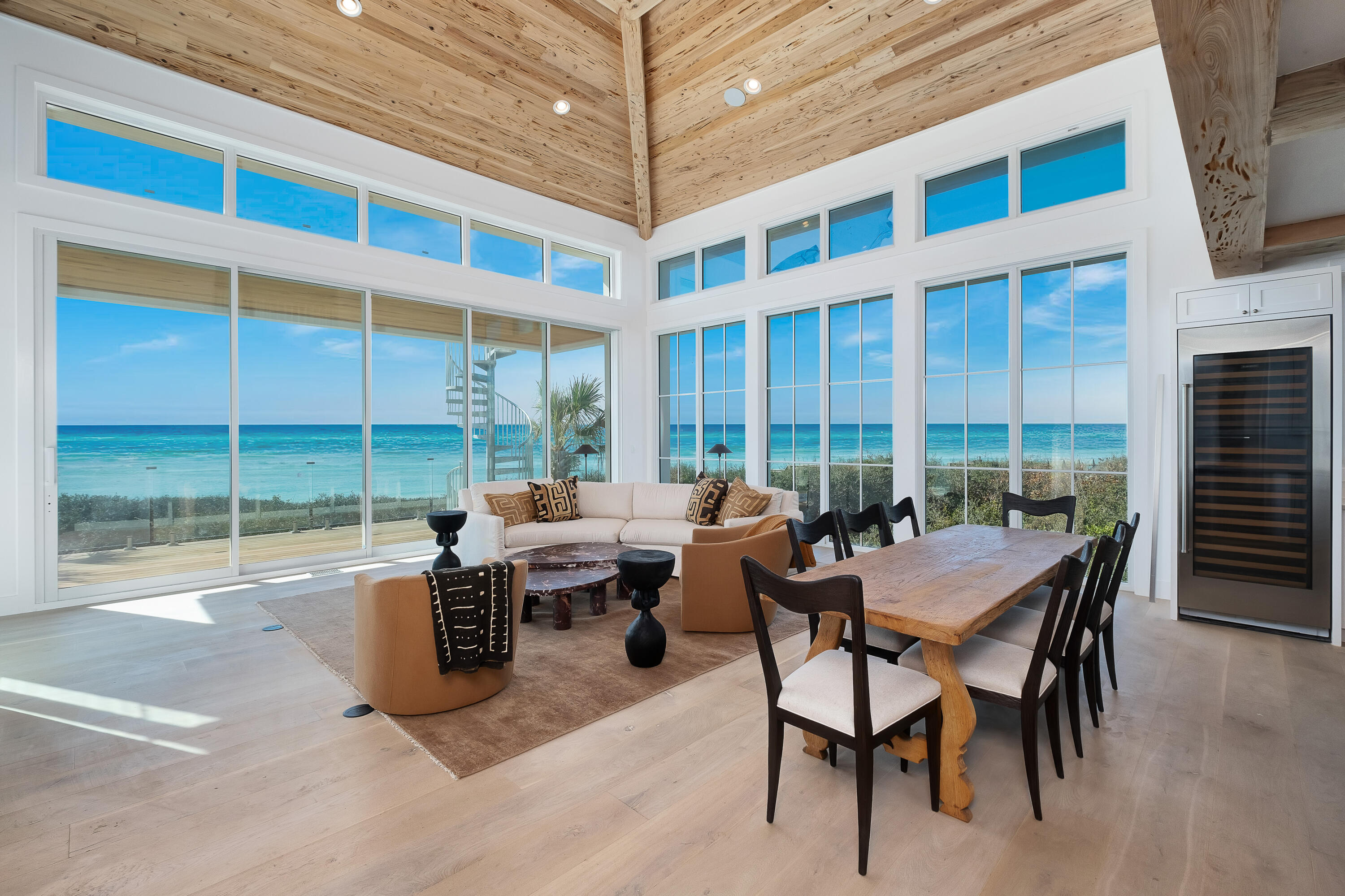 Experience coastal luxury at its finest in this exquisitely renovated Gulf-front residence. Nestled high above the sand within Jasmine Dunes—a gated enclave of just 14 exclusive homes graced by distinctive white concrete/stucco architecture—this home claims one of the most spectacular views along all of 30A.

Fully rebuilt from the studs, this like-new home combines hurricane-grade construction (steel framing, poured concrete, brand new Cat-5 windows) with light-filled luxury and timeless design: clean, modern lines, high-end fixtures, custom cabinetry, spa-like bathrooms, and an inviting open layout offer comfort and elegance at every turn.

On the main level, soaring ceilings, white oak, Venetian plaster and pecky cypress frame expansive Euro doors that open to an Ipe balcony with