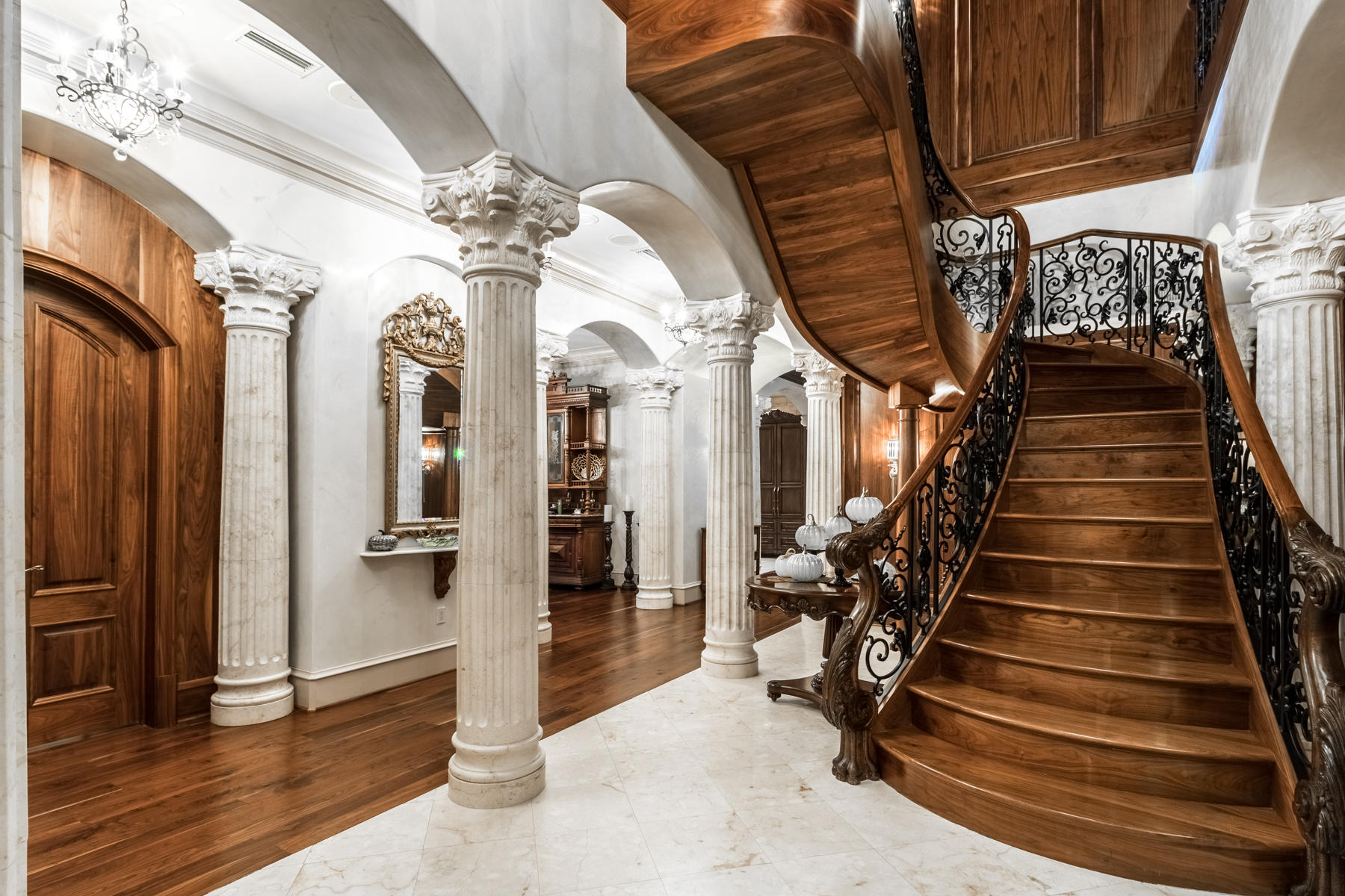 An amazing, custom-built residence offering the grandeur of an estate property with the convenience of Kelly Plantation's luxurious One Water Place condominiums! From its location on the 2nd and 3rd floors of the highly desirable Building 3, with the most ideal north and west-facing orientation, the 6800 SF residence enjoys a home-like feel due to its proximity to nature and easy access--yet it is elevated just enough to enjoy beautiful views of the lake and Choctawhatchee Bay and situated to maximize privacy.
The first floor is an entertainer's dream! It begins with a dramatic, two-story entry featuring the grandeur of a black walnut custom-designed wood staircase, fabulous ironwork, solid cast limestone columns, and elegant chandeliers. From there, many options are available for treating your guests, including a formal dining room, a huge bar area featuring white onyx counters and a lit display area adjacent to the comfortable living room, a music conservatory/parlor, and a lovely summer kitchen/outdoor patio with incredible stainless grill system. 
     
The residence's French flair is particularly evident in the gorgeous kitchen, which includes a La Cornue French stove and cooktop, a copper sink, hood, and fixtures, a double-stacked 3 cm granite-topped island, and elegant sea glass and wood cabinetry. The first floor also includes a 720-bottle redwood wine cellar and a lovely guest suite with sitting area, fireplace, spacious bath, and its own outdoor patio.
     
Up the incredible stairs (or private elevator), the rooms are still spacious but with a greater sense of intimacy. The master suite features double doors, a morning kitchen, huge bedroom with dual-sided fireplace to the sitting area, incredible bath with dual white onyx vanities, steam shower, and clawfoot tub. It also features a private balcony and window seat situated to take full advantage of the lovely, relaxing landscaping of OWP, including several fountains, a rock stream, flowers, trees, and lake/bay views. Room-sized themselves, the his-and-her closets are Hollywood worthy! Both additional bedroom suites include balconies as well.
    
An exceptional opportunity for a buyer who desires the convenience and amenities of a luxury, low-maintenance condominium but who is not ready to sacrifice space or spend a lot of time navigating elevators. The residence is being offered with a golf cart space and large, conditioned storage unit. One Water Place offers a secured building, covered parking, outdoor pools, indoor and outdoor spas, a full fitness center, locker rooms, game room, theater room, gorgeous lobby, gardening facility, boardrooms, dog park, walking trails, etc. In addition, Kelly Plantation offers a Fred Couples Signature golf course, clubhouse, tennis, playground, and much more!