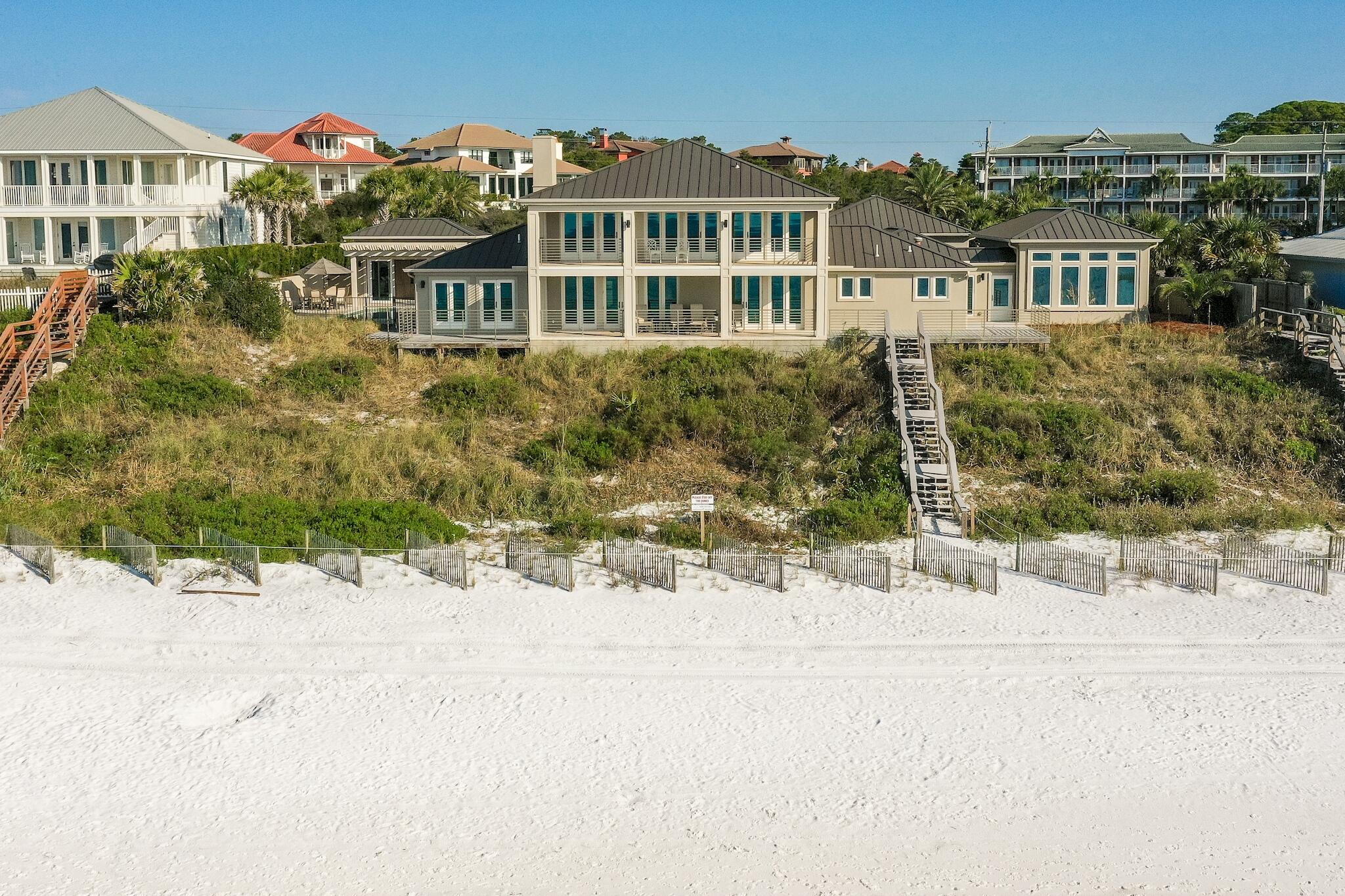 Unlike any other...This premier residence sits directly on the Gulf of Mexico, boasting 150 linear feet of pristine beach frontage on 1.2 acres. Located in walking distance to the restaurants and shops at Gulf Place in Santa Rosa Beach along Scenic Hwy 30A, this spectacular, sprawling compound features extraordinary views from the living room, dining room, kitchen, five bedrooms,  office, two 12'x38' covered porches, and a pool.  
Stunning views immediately awaken your senses as you enter into the open concept living room, dining room, and kitchen with beautiful wood beams, travertine floors, and a gas fireplace. Next, walk outside to a large covered porch, which is just steps away from the white sandy beaches and emerald waters uniquely found in the Panhandle of Florida. The first-floor gathering area is flanked by two gulf-front master suites and an office, all with beautiful views of the Gulf of Mexico. Additionally, a large bonus room, laundry room, and oversized three-car garage are on the first floor. 
Make your way upstairs to three gulf-front bedrooms with direct access to a large covered porch which provides the opportunity to take in the view and enjoy the warm sea breeze.
After spending time at the beach, relish the gulf front pool and deck with heated/cooled pool house fully equipped with TV, music, refrigerator, icemaker, and half bath.
Privacy and peacefulness is the name of the game when you own 1.2 acres, to the high mean waterline, with 150' of gulf frontage. The grounds are immaculate and include a beautiful circular driveway, which leads to an oversized three-car garage with tall ceilings, accommodating multiple vehicles and additional storage. A courtyard welcomes you to the home and the Gulf-front pool.
The original home was completely renovated in 2015, and a new master suite wing, oversized three-car garage, pool, and pool house were added.  Exterior features include concrete walls, impact windows and doors, foam insulation, and a standing seam roof.  Interior finishes include exposed beams, travertine, and hickory flooring, gas fireplace, Cambria countertops, LED lighting, custom motorized blinds, the list goes on and on. 
The current parcel comprises original lots 12&13 of unrecorded Plat Spires Estates and is zoned Neighborhood In-fill.
The area is served by Panama City Beach & Fort Walton/Destin airports with commercial service and FBO facilities. All information is believed to be accurate but should be verified.