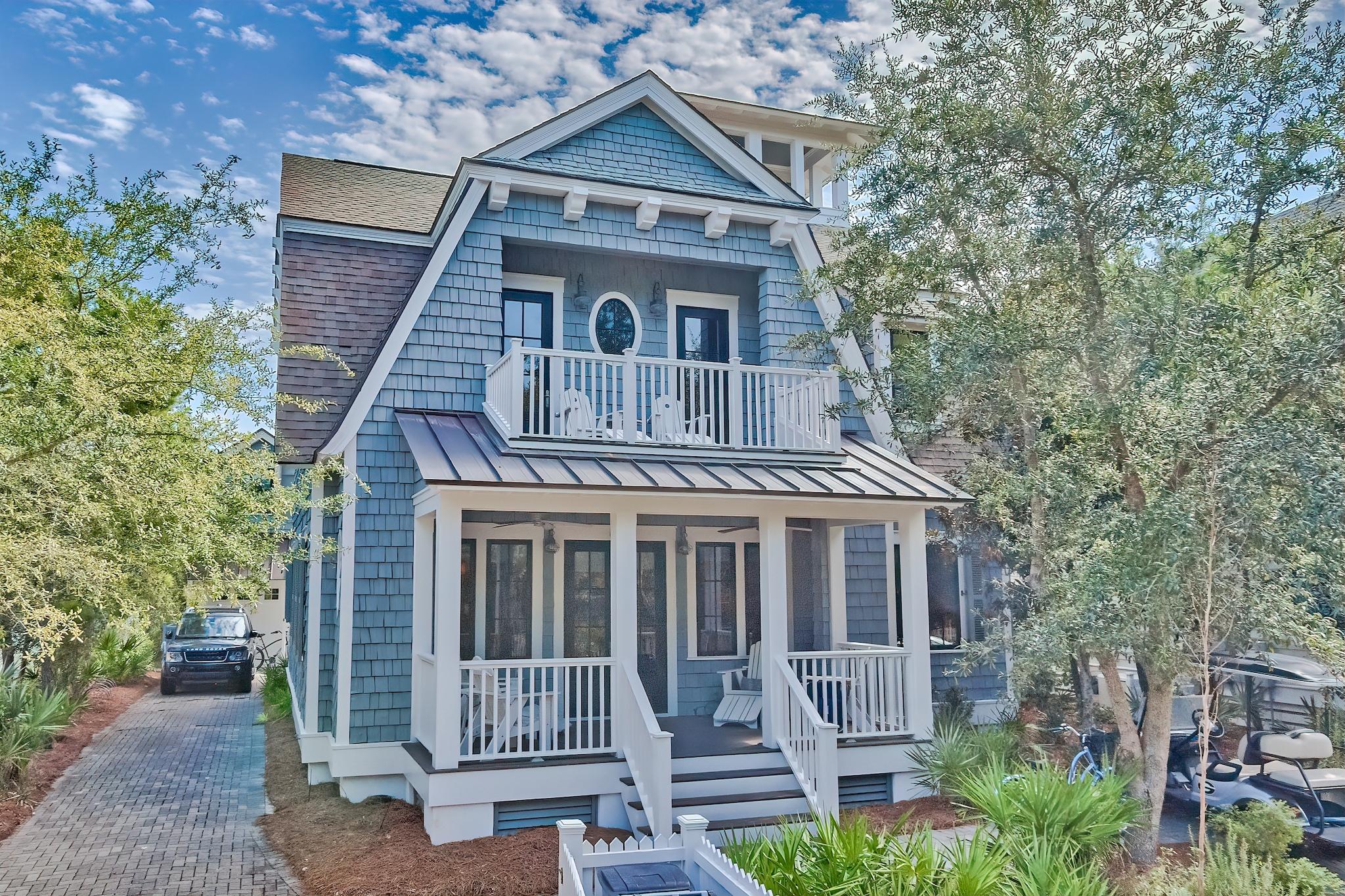 Located behind the private gates of Watersound Beach, this picturesque residence boasts over 3,700 square feet of thoughtfully designed living space bordered by lush vegetation and covetable Gulf views. A true icon of craftsmanship executed by the sought after architect T.S. Adams and renowned building team at Monte Hewett Homes. Upon entering the front door you are greeted by the charming living room adorned with wood plank ceilings and hand scraped Nordic white pine flooring. The Chef's kitchen features custom cabinetry, an oversized island, and top of the line appliances. Step outside and enter a world of your own: multiple outdoor living areas synonymous with relaxation include a screened-in porch, sun bathing deck, outdoor fireplace, and gunite pool. The sumptuous primary suite engulfed with natural light features a private balcony and luxurious bathroom with double vanity outfitted in pecky cypress, soaking tub, and custom tiled shower. An additional bedroom and bunk room complete the second floor. Retreat to the lookout tower uniquely designed for all-weather enjoyment with both indoor conditioned and outdoor sitting areas overlooking the dramatic skyline views. The carriage house located above the garage encompasses a  kitchenette, sleeping quarters, and an en-suite. Watersound Beach resides on 1,400 acres and over a mile of private white sugar sand beaches. The culmination of amenities and exclusiveness affords residents with the epitome of private coastal living while remaining geographically poised near the world-class dining and entertainment venues 30A has to offer. 67 Salt Box is a rare and special residence to be cherished by discerning owners for years to come- inquire today to schedule a private viewing.