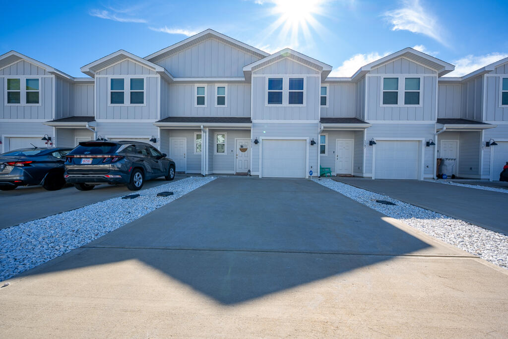 Welcome to 5711 Sandy Walk St, Gulf Breeze, FL, a like-new 2024-built townhome offering 3 bedrooms and 2.5 bathrooms. Optional fully furnished for $299,000. turnkey home features one master bedroom with an en-suite bath and two guest bedrooms, perfect for family, guests, or rental flexibility. The open concept living area showcases modern finishes, natural light, and a functional layout ideal for everyday living or entertaining. Built with quality construction and modern systems for efficiency and peace of mind. Whether you're looking for a smart investment property or a move-in-ready primary residence, this home is an excellent opportunity in a desirable Gulf Breeze location near beaches, shopping, military bases, zoo, and dining.