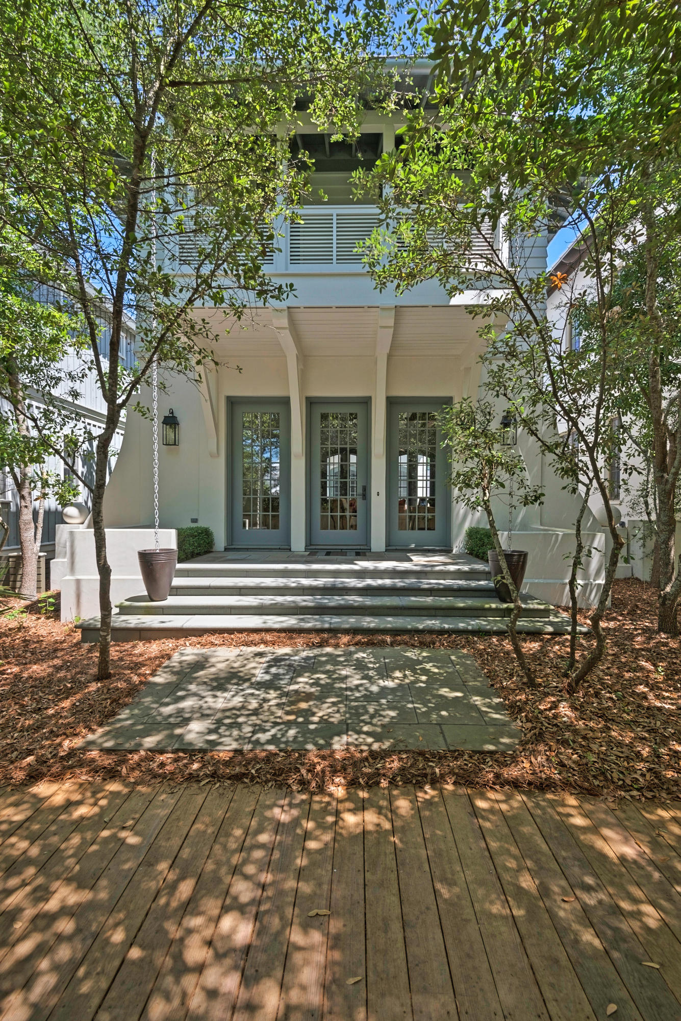 This stunning Florida home presents an unusual and appealing blend of sleek and modern and Old World with touches of New England. It's a place where privacy is treasured and impeccable craftsmanship is revered. One outdoor courtyard on gray cobblestone features a covered grilling and prep space along with a cushioned built-in bench and patio dining table for 6 or more or less and mingling of many. Another large, private patio space features comfy chairs and a water feature on a slate floor. The second floor hosts the master suite with private porch, a library wing flooded with natural light, an office, laundry and 2 additional guest rooms with en suite baths.
  The home has been recently renovated, and the kitchen,dining space and living room boast an eclectic charm with Old World-style hanging pendant lights. Contemporary Sub-Zero and Wolf appliances, quartzite countertops and thick, naturally-distressed wood beams against paper white ceilings meld function with beauty. Multiple doors and windows flood the interior with natural daylight. The gracefully appointed living room illustrates that every detail was considered prominently important. Motorized drapes, cutting-edge technology for entertainment and security and the tankless water heater are among the state-of-the-art accoutrements for fine living. Trees shade the entry and boardwalks that winds through myriad, easily accessible community amenities.