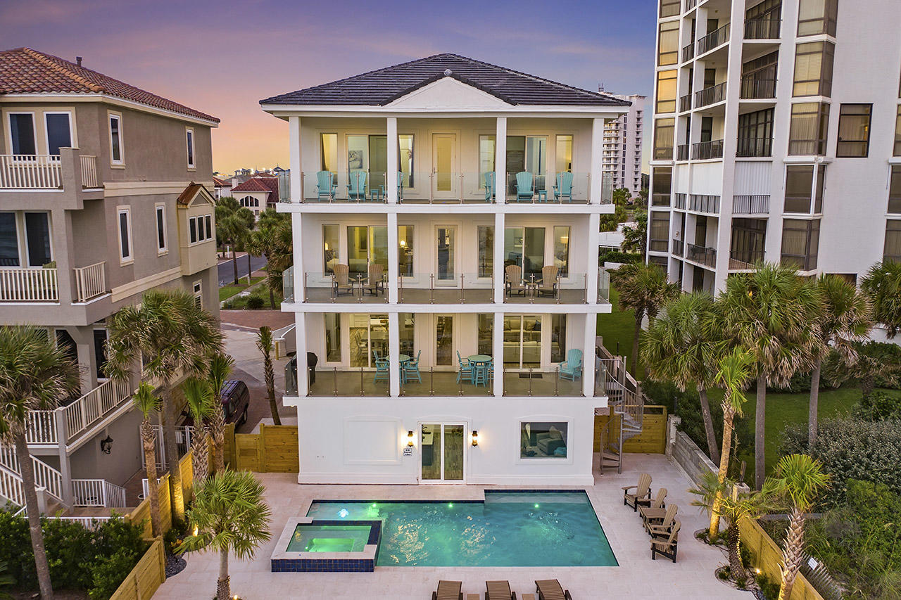True Beach front luxury!  From the breathtaking views from multiple balconies to the secluded beach, this is a coastal delight! With its recent and complete renovation to its Gulf front pool and spa, Semi True Story is a true Gulf front masterpiece. It features a new roof, stucco cladding, new windows & doors, new HVAC, flooring, kitchen and baths and a one of a kind custom built bunkroom suite that accommodates more than 12 guests. Sitting directly on the Gulf in the gated community of Dunes of Destin, Semi True Story affords breathtaking views of the water...with a private Gulf front heated pool & spa and private beach access.

The main floor features the living area of the home, complete with an elevator for easy access to all floors; and the sliding glass doors in the living room lead out to a balcony overlooking the Gulf, with seamless glass railings that offer an unobstructed view of the Gulf and spiral staircase that leads down to the pool deck.

Beautiful white walls, updated finishes, LVP floors, exposed beams, and pecky cypress ceilings create a clean and modern atmosphere; and the open floorplan of the main floor is perfect for the family to be together while eating meals or relaxing in the living room. The extravagant kitchen features floating shelves; brand new, top-of-the-line commercial appliances including two dishwashers; and a spacious pantry. Much like the rest of the house, the dining area is perfectly situated for allowing beautiful views while gathering around the large dining table.

Offering a perfect sanctuary space, the third floor features a common area with a bar complete with floating shelves, a mini-fridge, and a coffee and wine area with a bar table. Two gulf-front bedrooms, each with a private bath and a walk-in closet, are located on this floor. The master suite boasts beautiful Gulf views with private access to the balcony. The private bathroom has been completely upgraded with a large standalone shower, free-standing tub, and a dual-sink vanity. Step onto the balcony where you can see the water through the seamless glass railings while you enjoy a hot cup of coffee in the morning or enjoy a glass of wine in the evening. Next door, the secondary master features a private bathroom with a walk-in shower and private access to the Gulf-front balcony.

The entire lower floor of the home consists of an enormous bunk room, uniquely configured with three built-in queen-over-queen-over-queen bunk beds, each with individual mounted flat-screen TVs. Two sofas offer seating around a large flat screen TV; and the space also features two bathrooms, each with two standalone custom showers. Just off of the bunk area is a queen bedroom and a laundry room. Step onto the pool deck and splash into some fun in this stunning private pool with a built-in hot tub, or use the private beach access for a day out on the sand!


The fourth floor is home to four more King suites, perfect for accommodating guests. Each with their own bathrooms, two of the suites are Gulf front while the other two afford views of the Gulf. Semi True Story has been freshly renovated from top to bottom to meet the needs of a variety of buyers, with an entertainer's lifestyle in mind. Splash around in the large private pool and hot tub or relax on any of the balconies and enjoy unobstructed views of the Gulf and make memories that are sure to last a lifetime. This home is located in the gated community of Dunes of Destin and is in close proximity to numerous shopping and dining options in Destin's Harbor district.