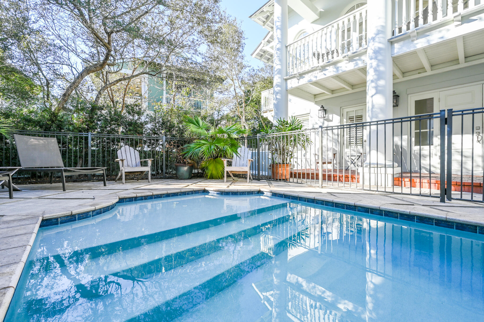 Tucked away on a quiet dead end street, south of 30A, this Rosemary Beach home boasts one of the largest private pools on the south side of Rosemary. Large porches and generous outdoor patio spaces embody the original vision of outdoor living in Rosemary. Quality craftsmanship abounds from detailed molding throughout, a beautiful sweeping staircase, and concrete block construction. The stately main house sleeps 10, with two master suites.  A highly functional carriage house, with full staircase, sleeps 4 and sits atop a 2 car garage. This lovely home is just steps to the tennis courts, playground, Coquina Pool, and beach walkovers A & B. Walkover A is one of only 2 handicapped accessible beach access points in Rosemary.  Very strong rental history. Rosemary Beach is an idyllic beachside community, with a bustling downtown, home to many excellent shopping and dining options.  3 large outdoor swimming pools, one indoor pool, tennis courts, a fitness center, numerous outdoor green spaces, a community playground, and mature landscaping are just a few of the unique features of Rosemary Beach.  Owners will have exclusive access to the Owners Club as well.