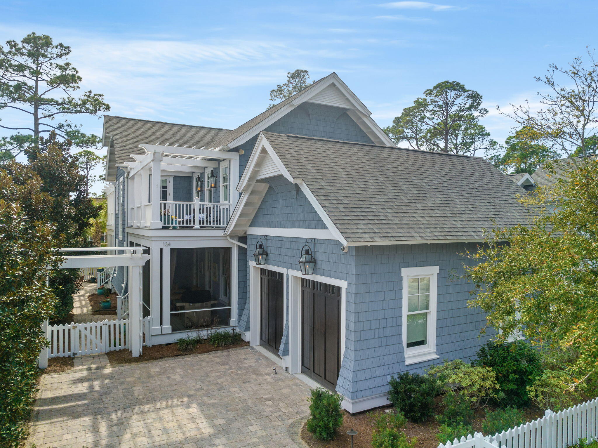 Custom built by Babin Builders in 2013 and winner of the coveted APEX award in 2014, this Watersound West Beach home, overlooking the community lake, offers the perfect blend of luxury, comfort, and natural beauty. From its impeccable design to its serene surroundings, this home is sure to captivate your heart. Designed with meticulous attention to detail, this residence boasts a timeless and elegant architectural style that seamlessly blends with the natural landscape.  With over 3,500 square feet of living space, this home offers ample room for your family and guests.   The chef's kitchen is a culinary masterpiece, featuring Wolf/Sub-Zero appliances, stone countertops, and a large center island. The combined dining and living room offers a spacious open floor plan, complete with a folding glass wall that opens to bring the outside in.  Upstairs, you will find the master suite - a private oasis, complete with a spa-like en-suite bathroom that includes heated marble floors and steam shower, a walk-in closet, and serene views of the surrounding woods from your private screened balcony.  The outdoor living spaces are a true highlight, with screened porches, spacious decks, and a beautifully landscaped yard.  Add to this, 3 guest bedrooms, each with a private bath, bonus room with a second wet bar, dedicated private office and custom laundry/mud room.  Rounding out the home - a gas powered whole house generator, central vacuum system and mini-split unit in the oversized 2-car garage.

Watersound West Beach, a gated secure community south of 30a, offers amenities such as private dedicated beach access, a zero-entry heated and cooled community pool with a boardwalk system throughout the neighborhood.  Included in your homeowner assessment - high speed fiber internet, basic cable, annual household membership to Florida State Parks and access to Watersound Workout.
