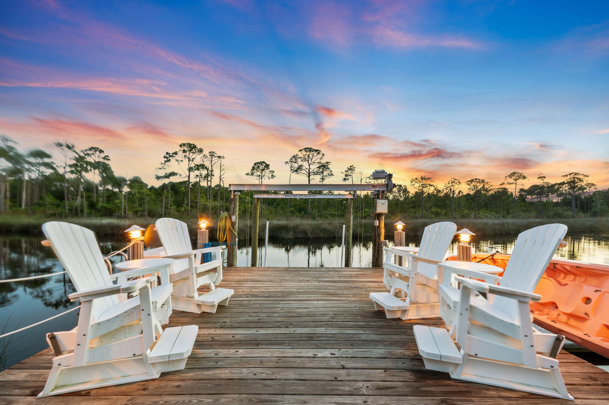 Boating enthusiasts, look no further!  Timeless beauty right off the Bay! Direct access to deep water! IMMACULATE single-story home.   2023 tile roof & solar panels. Approx $25 a month electric bill!  New A/C. New dock. Enter the double doors and enjoy the spacious great room filled with natural lighting and warmth. Large dining room converts to pool table for entertaining! Spacious open kitchen remodeled with quartzite counters. GE Monogram fridge, Thermador gas cooktop, custom cabinets. Central vacuum system. Step out on the lanai and enjoy paradise with remodeled auto-drain tropical pool & spa/fountain w/ outdoor kitchen and watch AMAZING sunsets in the Adirondack gliders. SONOS ceiling speakers throughout home. Dining room/pool table, Master BR, TVs, SONOS system, washer/dryer convey 3/3 with separate office can easily convert to a bedroom. Bonus room currently an office but can be overflow BR, gym, storage.

Regatta Bay offers a luxury golf-cart community lifestyle experience with amenities including 18-hole golf course, tennis courts, pickle ball, lap pool, playground, and a variety of dining options just outside the resort gates.  Destin Commons shopping, Whole Foods, Lowes, and a mile from the most beautiful Emerald Coast beaches awaits you a golf-cart ride away!  No need to drive a car on Hwy 98!!