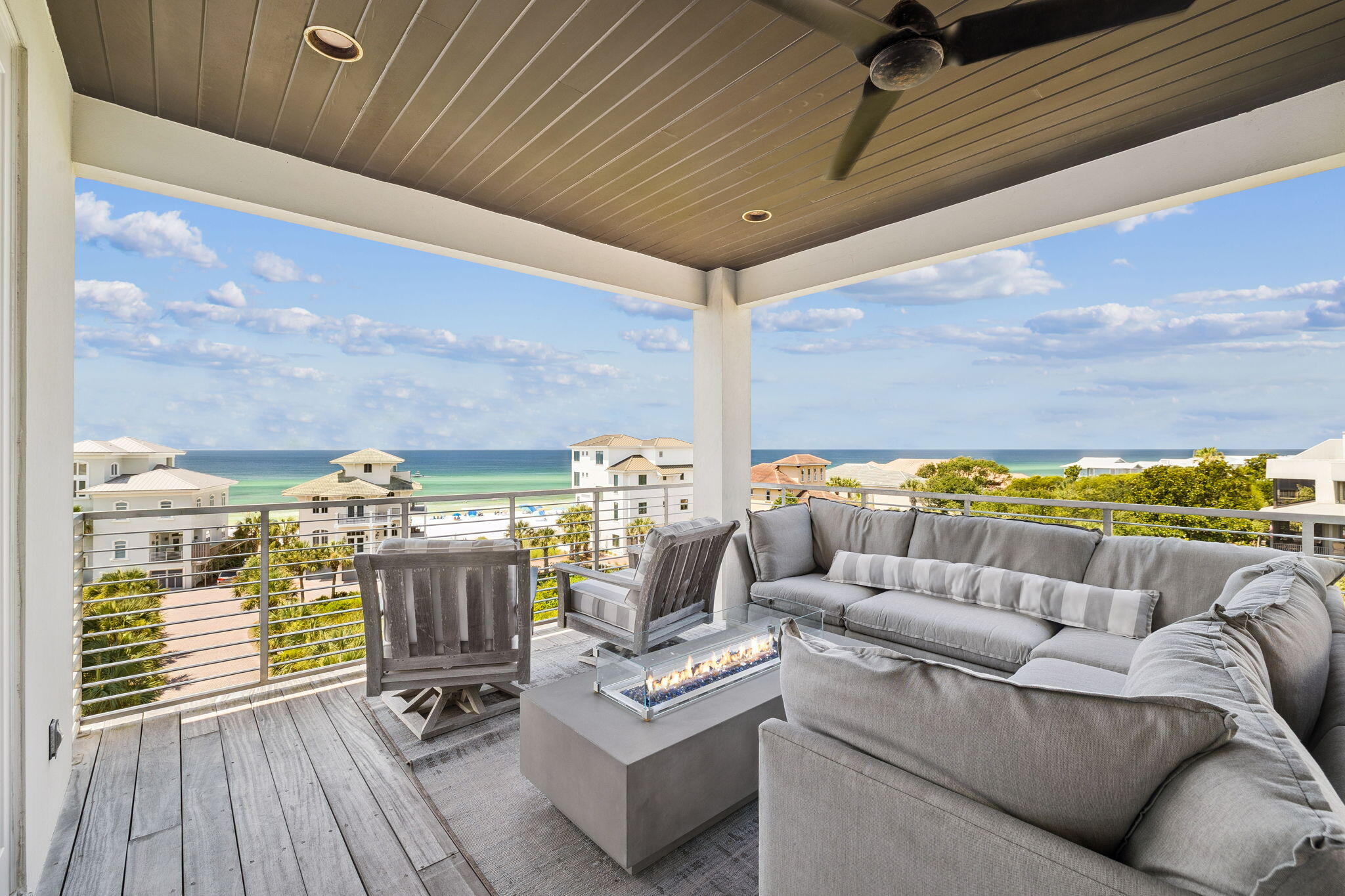 This luxurious home is located south of 30A at Caspian Estates in a corner lot with forever Gulf views. The neighborhood has nine homes with 2 private entry gates and a pool.  This 4,858 sq ft home has 5 bedrooms, 5 full baths, and 3 half baths. The house has a 2-car garage and front porch sitting area both with exterior gas lanterns. House has a custom millwork staircase with gorgeous chandeliers and 4 floor accessible elevator.
The first floor includes an entry foyer, staging area, humidity-controlled wine cave, oversized laundry room with washer/dryer, storage closet, half bath, bar with sink/refrigerator/ice maker, and guest bedroom with king-sized bed, full bath & double closets. The laundry room opens to an exterior walkway with access to an outdoor shower with hot & cold water. The second floor includes a guest suite with full bath, laundry closet with washer/dryer, and primary suite. The guest suite includes a "swinging" king bed & two custom wall mount bunk twin beds, bathroom with double sinks and soaking tub & shower, and walk-in closet. The double-door entry to the primary suite has a feature wall behind king-size Tempur-Pedic bed with dual controls, built-in cabinets, morning bar with refrigerator, and wall-mounted television. The master bath includes a spa bath with a freestanding tub and double head shower with Kohler audio system, double sinks, Bidet toilet, and walk-in closet with vanity table, lighted mirror & sink. The primary suite leads out to a private covered 2nd floor porch with forever Gulf views from the swinging bed.
The third floor with 11 1/4 ft ceilings includes the main living room with gas fireplace, dining room, kitchen, bar with sink/ice maker/refrigerator, half bath, and bedroom with full bathroom with double sinks. The gourmet kitchen has high-gloss white cabinets, backsplash window, corner pantry, and center island. Kitchen has Jenn Air appliances including refrigerator, gas range, double ovens, built-in microwave, built-in coffee/cappuccino maker, and dishwasher. The 3rd floor covered balcony is accessible from the living room and the kitchen with retractable sliding glass wall doors that open to a corner porch with a built-in Lynx grill & dining area with beautiful sugar sand & Gulf views.
The fourth floor includes ocean-view living room, half bath, and junior primary suite. The living room has a wet bar area with liquor storage, Sub-Zero wine tower refrigerator, & icemaker as well as television retractable from ceiling stowage. The junior suite with Gulf views includes a king-sized bed and bath with double closets, storage closet, shower, and double sinks. The 4th floor balcony is accessible from the living room as well as the junior primary suite.  This balcony is 447 sq ft with forever Gulf views covered terrace with gas firepit sectional seating & television sectional seating areas.
This contemporary home has been professionally furnished and styled for the beach community south of 30A.