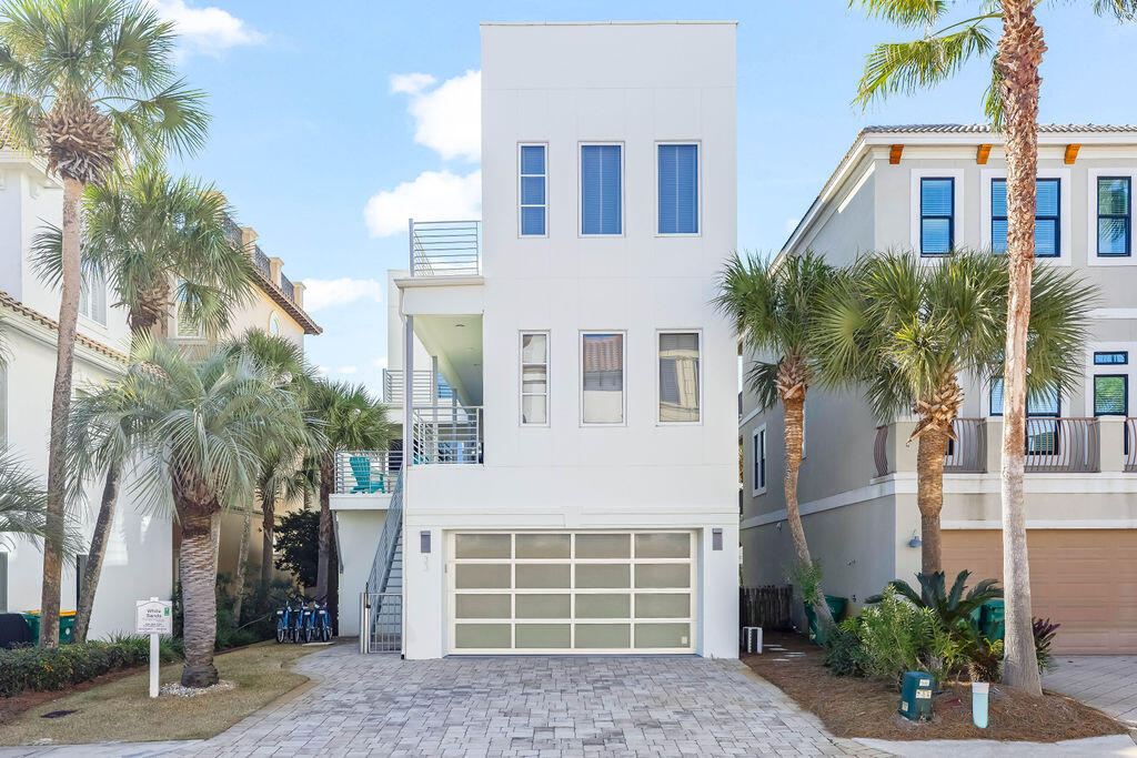 Located approximately 180 feet from the beach access and just two homes back from the Gulf in the guard gated community of Destiny by the Sea, this contemporary five-bedroom property can comfortably accommodate up to 14 guests.  

The first level includes a two-car garage, two bedrooms with private baths and a separate living room providing additional space for guests to relax.

The second floor includes the main living are with a chefs' kitchen framed by floor to ceiling windows for natural light.  The kitchen offers stainless steel appliances, custom cabinetry, white quartz countertops and a large island with seating.  The second level master suite provides Gulf views and multiple doors leading to the wraparound pool deck, an en-suite bath with a soaker tub and separate shower.

Upon purchasing the home, the current owner undertook a comprehensive renovation to address deficiencies associated with previously improperly installed windows.  The project included removal and replacement of affected stucco, damaged drywall and structural components necessary to complete the reinstallation and improvements to homes weather proofing and moisture protection systems to restore the building envelope.

Pool Replastered November 2025

Seller is offering 2-10 Renovation Warranty The third floor includes an additional living area with a Pac-Man arcade console, bunk room with en-suite bath featuring dual showers and a master suite that includes a soaker tub and separate shower.  Oversided windows and large sliding doors open to a balcony with a view of the Gulf and private pool below.

The rooftop deck provides expansive Gulf views along with two separate seating spaces for entertaining.