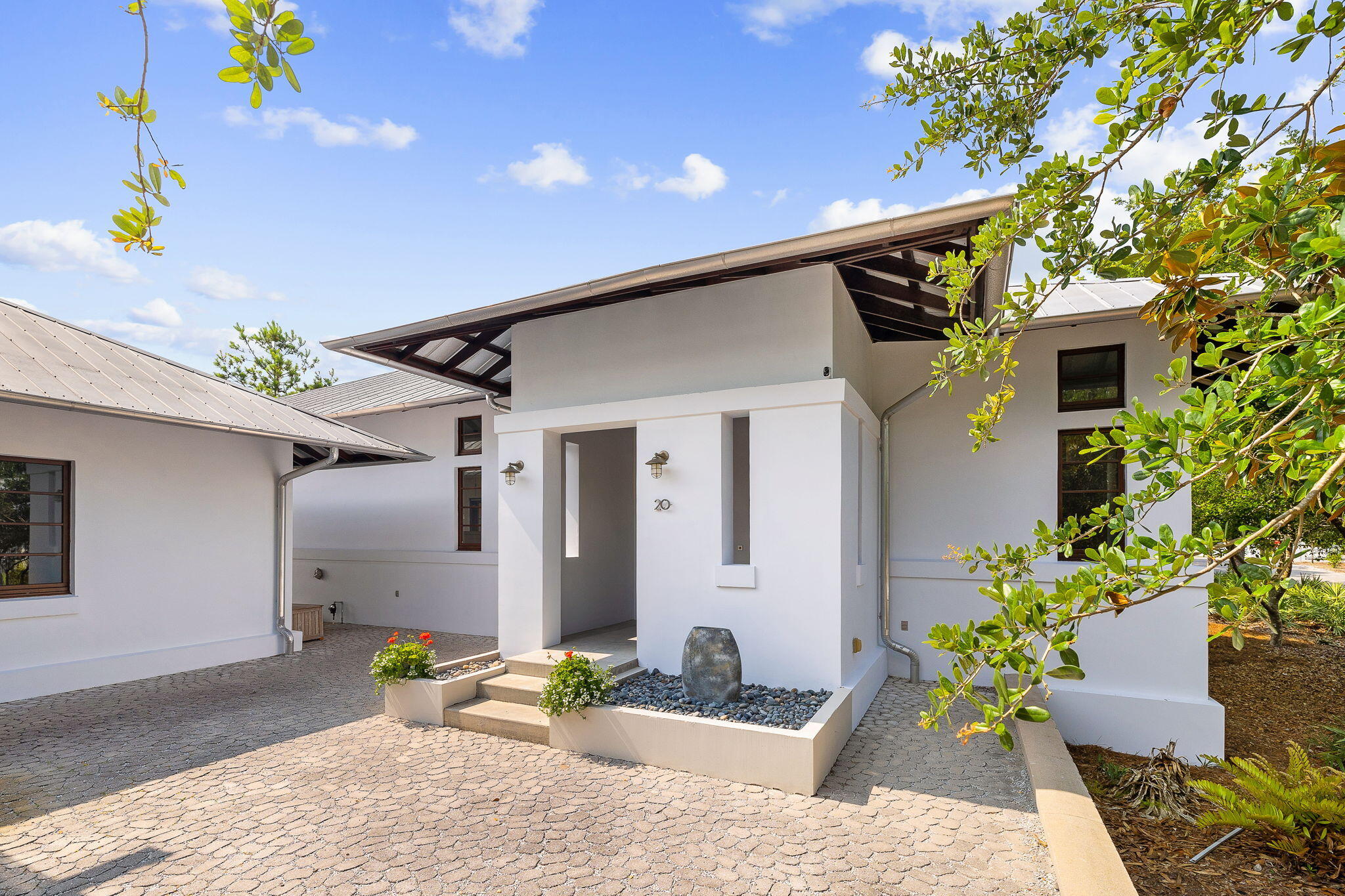 Freshly Painted inside and out! You Don't Want to Miss this One of a Kind 3,900 sq. ft. sanctuary nestled on 1.4 acres in a serene secluded environment and no HOA! This 4 bedroom 4.5 bath plus office home with 3 car garage is unlike any other property on 30A. With every detail meticulously and thoughtfully chosen, this Concrete/Stucco home blurs the line between indoor and outdoor living. The Main home offers 2 bedrooms 3.5 baths, an office, and a very large living, kitchen dining area with 12 foot ceilings (perfect for entertaining), an indoor lap pool, outdoor kitchen and spa. The detached guest home offers 2 bedrooms, 1 bath, full kitchen living area and a quiet screened porch. Home is solid concrete with a full home generator.