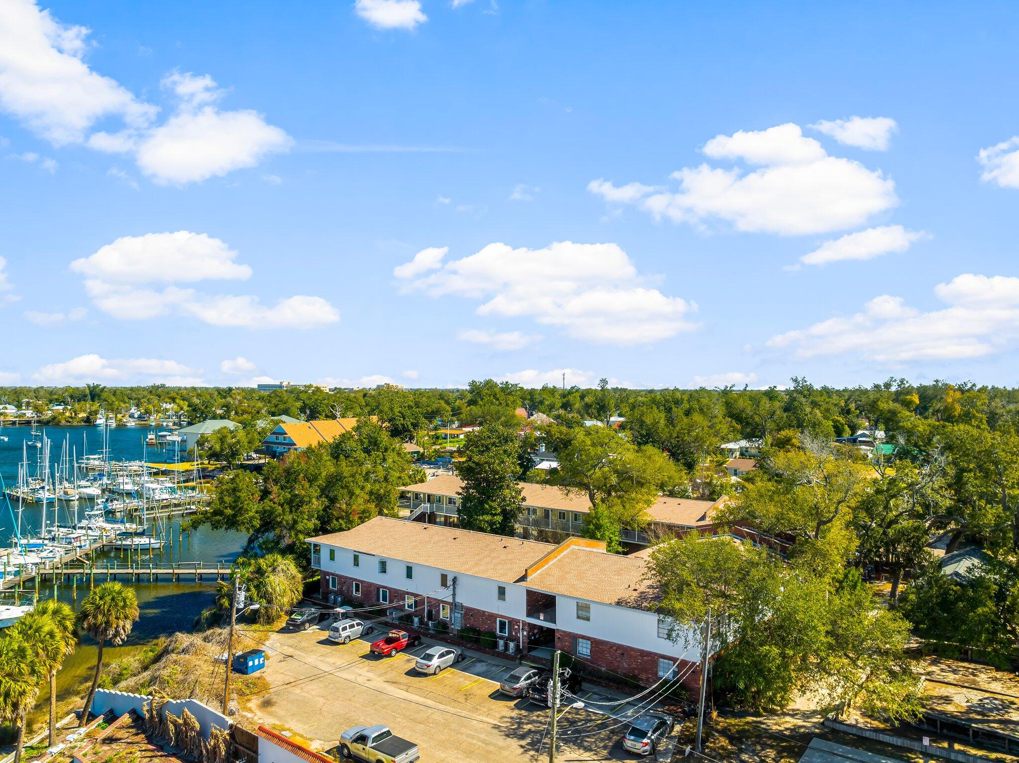 UNDER CONTRACT. SELLER WILL CONSIDER BACK UP OFFERS. This exceptional 34-unit waterfront community, complete with a 22-slip marina, is now offered at a newly adjusted price, creating an even stronger value proposition for investors. In addition to its comprehensive renovations and prime waterfront amenities, the property includes an income-generating on-site laundry facility and a low-maintenance marina that produces steady net revenue, further strengthening the asset's operational performance. With 22 units fully renovated down to the studs in 2020, upgraded mechanicals, new roofs, contemporary interiors, and a history of consistently high occupancy, this community offers both stability and long-term growth potential. Positioned within the heart of Downtown Panama City's ongoing revitalizationfeaturing upgraded streetscapes, improved walkability, and renewed waterfront developmentthis asset remains one of the most compelling opportunities in the market. The pricing adjustment simply aligns the offering with current investor activity and enhances the property's already strong return profile.
