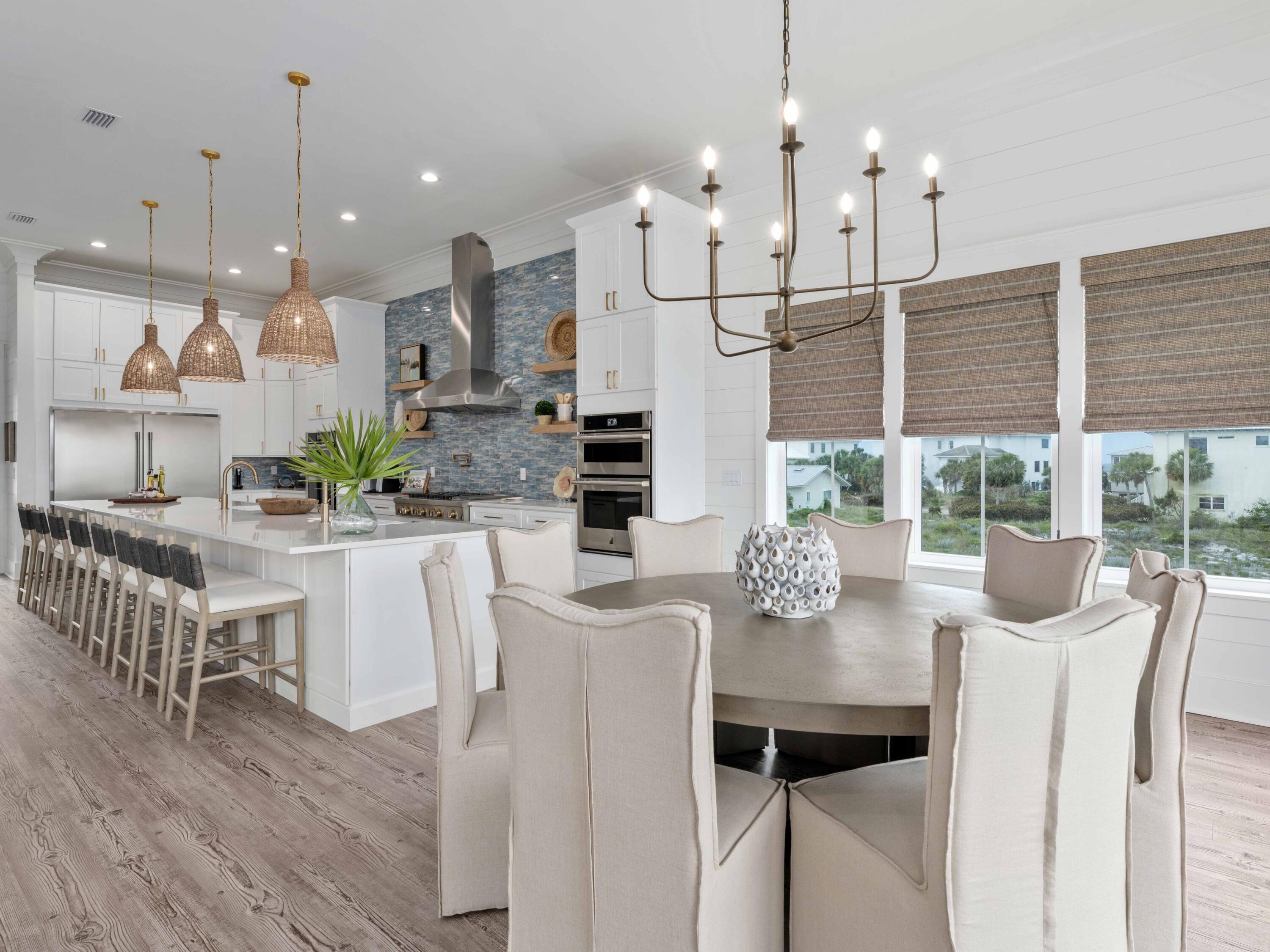 Located in serene Gulf Pines just a short distance from the beach, this three-story home has a plethora of indoor and outdoor living spaces. Occupying a fenced oversized lot, it provides limitless possibilities for spending quality time with family and friends. Seven bedrooms and six-and-a-half baths ensure everyone has their own private space in this luxury vacation hideaway. Built in 2021, this beautiful beach house has clean lines and generous windows creating bright rooms throughout. The kitchen wows with its white Shaker-style cabinets and eye-catching blue accent wall. It comes fully equipped with two dishwashers, ovens and microwaves, and an oversized gas cooktop with a useful pot filler. Check out the extensive island bar that accommodates two sinks, has abundant prep space and still offers room to seat eight diners. The adjoining dining area can also host eight for dinner or card games beneath the contemporary light fitting. Wood-look LVP flooring provides a seamless flow into the sitting area with TV while sliding glass doors open onto a deep deck for dining within sight of the beautiful Gulf of Mexico. Shiplap walls, stylish light fittings and impeccable decor make this an amazing beach house for rental income. An oval garden tub and walk-in shower grace two light-filled master suites on the third floor. The built-in bunk room is sure to be a hit with young guests while the breakfast station with coffee maker and refrigerator will be popular with grown-ups. Take your morning coffee out onto the balcony and start the day at a gentle pace. Make plans to relax beside the private pool or jump in the bubbling hot tub before rustling up lunch for everyone in the outdoor kitchen. At the end of the perfect day, sip sunset cocktails at the poolside bar before spending the evening having fun in the fully equipped game room or watching a favorite movie together. The white sandy beach, shops, restaurants, golf and activities are just a short distance away.