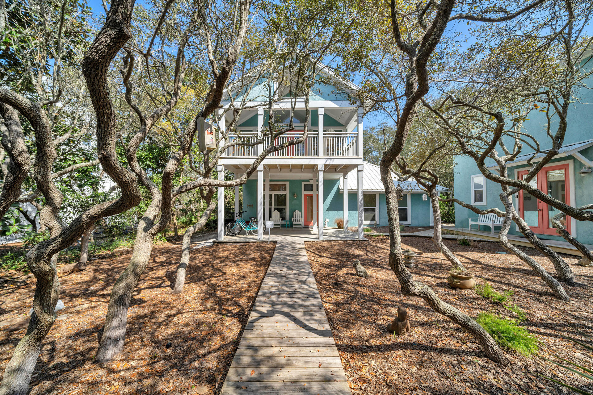 Terrific investment opportunity!  This centrally located home on 30A in the middle of Seagrove has fabulous rental numbers and is currently on the rental program.  2 short streets back from the emerald green waters of the gulf of Mexico and white sandy beaches and convenient by foot or bike to the eclectic local eateries and boutiques of 30A, this property promises to provide relaxation and vacation to every guest and family member blessed to stay in it.  A 600+ sq foot guest house amplifies privacy and comfort for friends and family.  The private pool in the backyard oasis suggests a quiet respite after a fun filled day on the beach or exploring the paths along 30A.  The recent remodel of the kitchen and bathrooms optimizes carefree use of easy open neutral cabinetry, white granite countertops and oversized rectangular sinks.  Beautiful herringbone cream backsplashes carry continuity through the kitchen and the bathroom showers and bathtubs.  Natural light streams in from balconies and long windows inviting the beach life inside and is intensified by natural woven window blinds and chandeliers over the kitchen island.  Turquoise beach colored accents warm the otherwise cool colors of the white walls, tan tile and wood floors.  Looking for the ultimate beach home - this is it!  New Peadan HVAC in Main House in 2022.  New Peadan HVAC in Cottage in 2021.