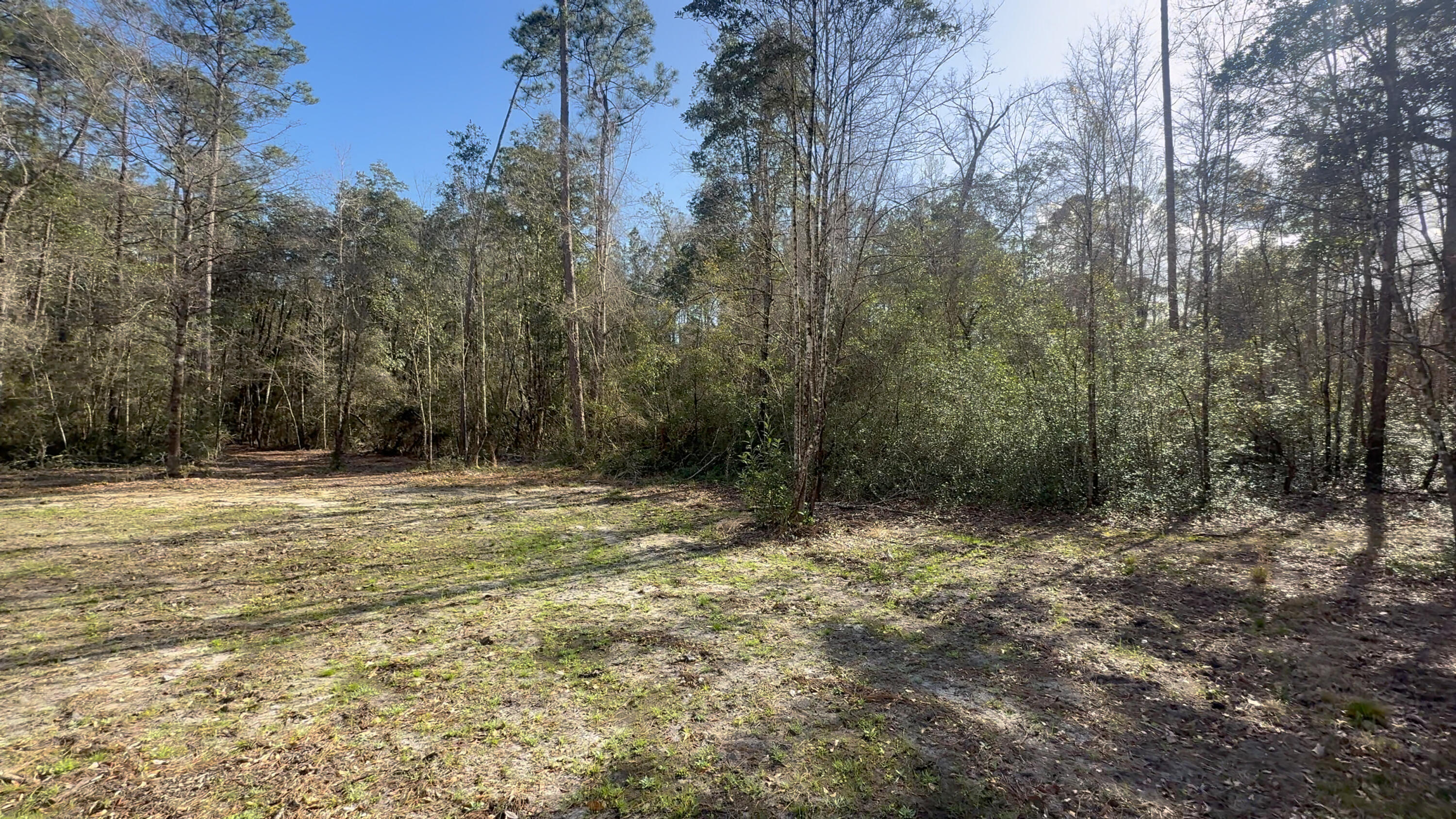 Vacant land offering 18.69 acres, with an additional adjoining 15.09-acre parcel also available for purchase. Combined, both properties total 33.78 acres of private land.

This property is accessed by a shared easement with two other owners, and zoning does not allow development, making it ideal for those seeking a private recreational retreat, family compound, or outdoor getaway. The land features natural topography, a creek running through the property, and areas suitable for wildlife and deer plots, creating an excellent setting for nature enthusiasts and hunters.

With plenty of room for recreational vehicles, four-wheelers, and outdoor activities, All showings must be booked & accompanied by a realtor.  Partially cleared areas provide opportunities to create trails, gathering spaces, or a private escape surrounded by nature.

Enjoy the balance of seclusion while still having convenient access to nearby grocery stores and everyday essentials. Located less then ten minutes from New "Wallace lake K-8", approximately 40 minutes to downtown Pensacola, and about 50 minutes to the beautiful white sand beaches of Pensacola Beach.