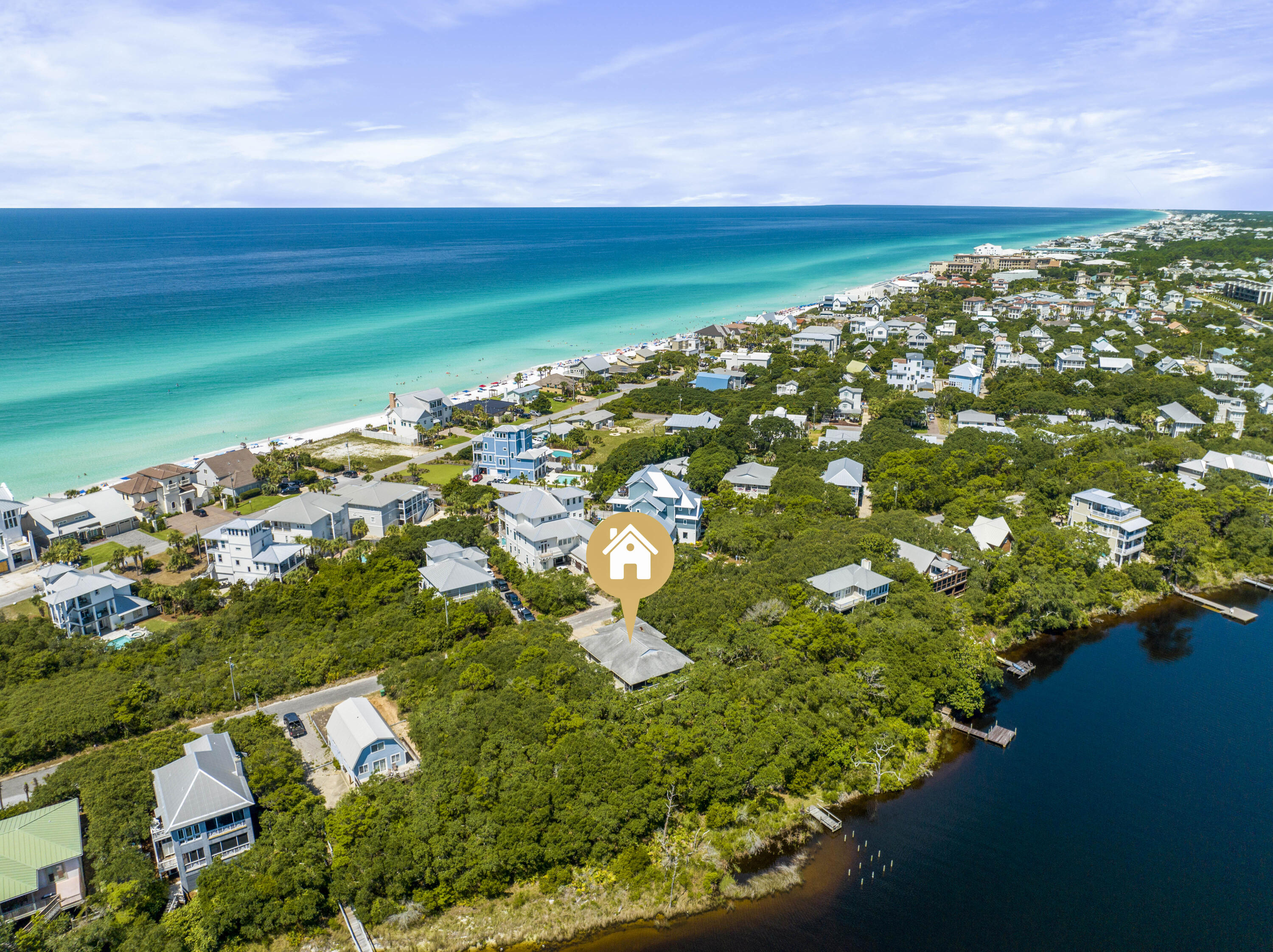 Nature Lover's Dream! Lovingly cared for lakefront beauty in the Old Blue Mountain Beach neighborhood harkens back to the 30A of yesteryear. Built high up on the bluff overlooking the lake, this strong and sturdy home has withstood the test of time. Currently set up as a three bedroom house with a two bedroom apartment, it could easily be reconfigured to a five bedroom house. The large two car garage has room for all your beach toys. Also there is a full sized space underneath the house with a view of the lake that could be screened and turned into an outdoor recreation room. Five neighborhood beach accesses are a short distance away and no busy roads to cross make a day at the beach a breeze! Take your kayak or paddleboard out on the lake. If you choose, you can paddle all the way to the lake outfall where lake and beach meet. Explore Pt. Washington State Forest by accessing the trail on 83 just a walk or bike ride away. Amazing local restaurants are nearby as well as a health food store, bakery, ice cream and donuts, tacos and live music, and a pharmacy. Come see why so many have found Blue Mountain to be the best location on 30A for full time living or a legacy family vacation property. Coastal dune lake properties have special conservation requirements. See documents tab for further information. Buyer to verify room dimensions and square footage.