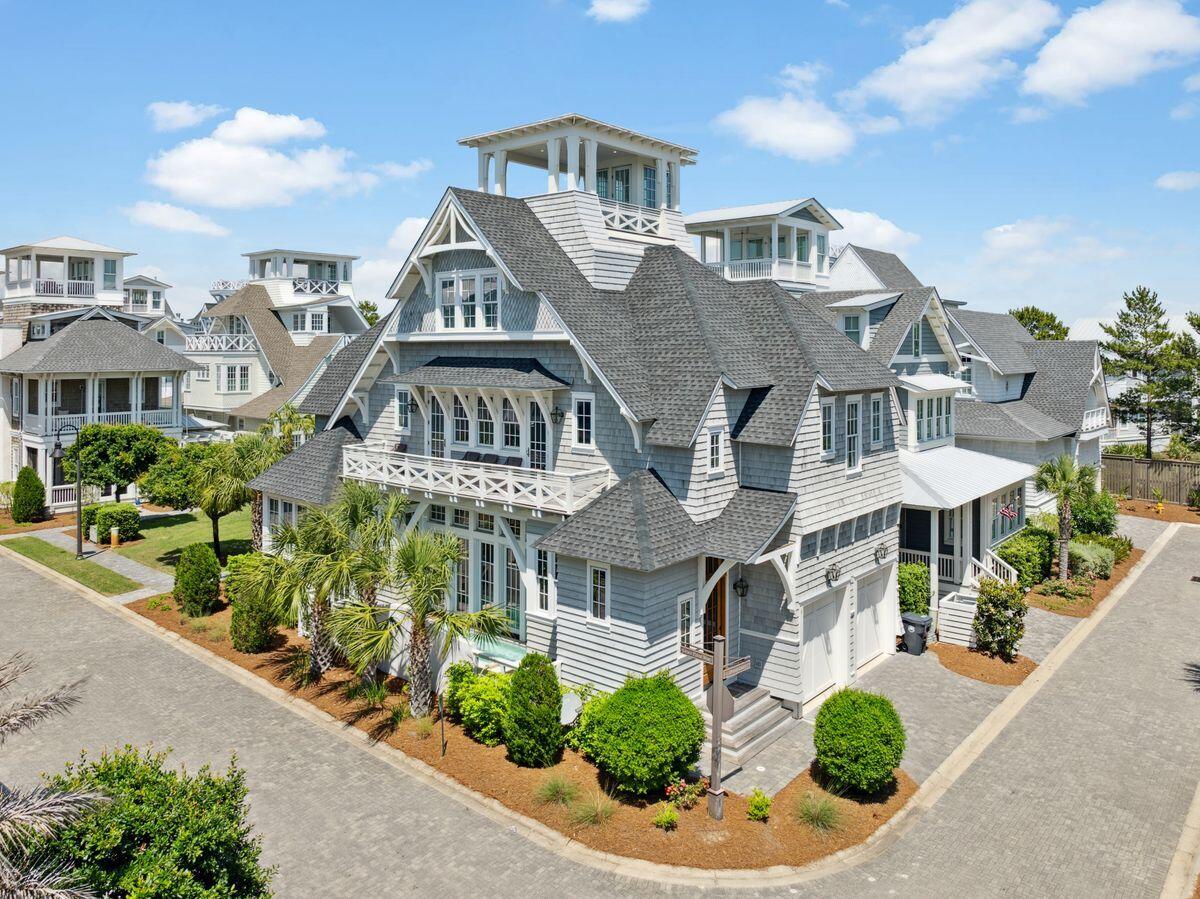 A vision of contemporary ease in an exclusive gated enclave, this residence stands gracefully along a verdant green space within Grace Point, one of 30A's most refined beachfront communities. With gulf views, a corner lot position, and seamless transitions between interior and outdoor living, this residence exemplifies thoughtful design in a peaceful, non-short term rental environment (minimum 28+ day rentals).

Natural light pours into every corner of this open, coastal home. Comfortably sleeping 14, the floor plan is designed for connection and flow--each of the four bedrooms, plus a dedicated bunk room, includes its own ensuite bath. Clean-lined updates by Summer House Lifestyle infuse the interiors with modern sophistication, while the outdoor living area features a private pool positioned to maximize both privacy and views.

A two-car garage adds convenience, and the gated access to WaterSound Beach Club places top-tier dining, fitness, and resort amenities just moments away should you choose to join. Whether lounging poolside or watching the gulf shimmer in the distance, life here offers an effortlessly elevated beachside rhythm.