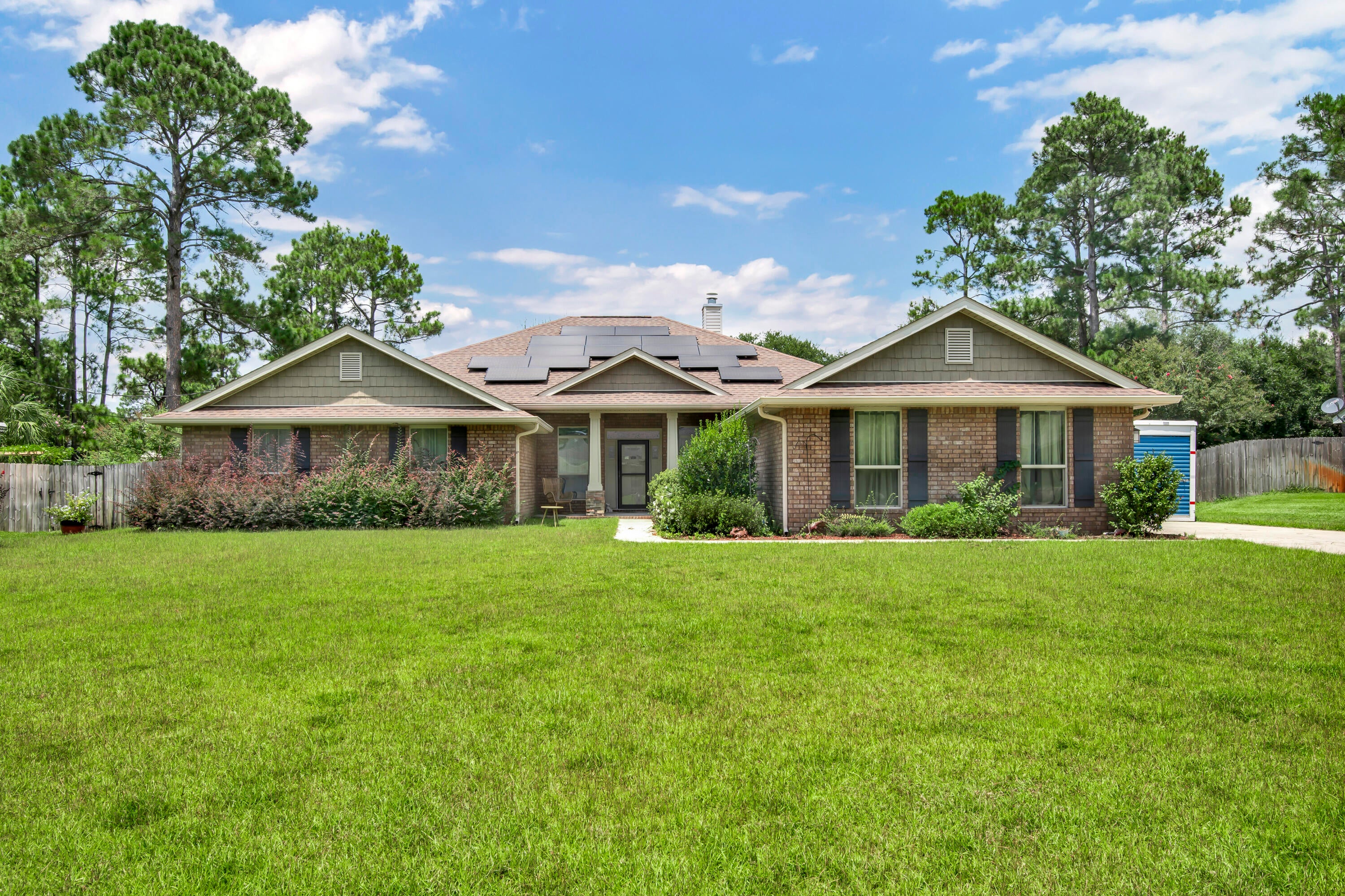 This ONE owner home features 4 bedrooms, a Great Room and family room with 2.5 bathrooms all within a 2950+ sq ft. Granite counters are throughout the home with beautiful cabinetry as well, the kitchen has an additional island with breakfast bar as well as a step-up serving area facing the family room. The kitchen is topped off with a double oven smooth top stove and large fridge. The Great room is truly that with cathedral ceiling and a large stone-faced fireplace. Tile floors flow through the home in all areas with exception of the office and bedrooms. The hall bath has a great addition of a walk-in tub with jets. The Master bath features double walk-in closets a soaking tub as well as a separate tile shower. Outside solar panels are on the roof to lower those utility bills. A covered patio as well an open patio gives plenty of room for family gatherings. The home also has a three-car garage and two storage and workshop structures in the fenced back yard. With the amenities of Holley By The Sea and great location this is a great home for any and all. Take a look!!