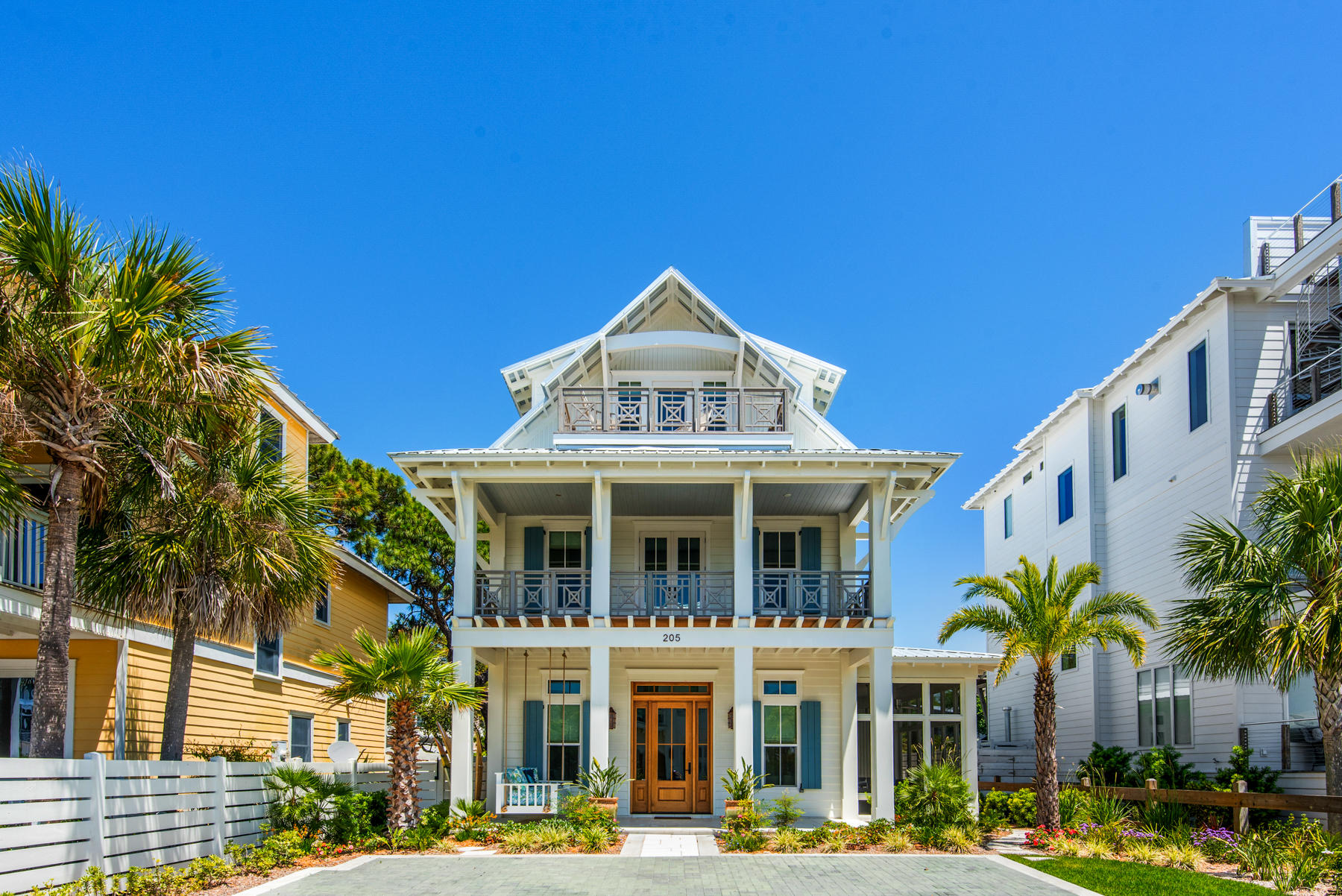 Exquisitely designed home, located in beautiful Grayton Beach! This architectural masterpiece perfectly blends the luxury and coastal lifestyle. Situated on a quiet street away from the hustle and bustle, but still within walking distance to all of the great restaurants and shopping that Grayton Beach offers. The home was constructed with great attention to detail and quality features throughout. The house consists of 3,606 SF heated & cooled with an open floor plan and expansive covered outdoor living areas. It has huge windows and glass doors that invite the beautiful outdoors and sunshine in, a large screened in porch, beamed ceilings, top quality engineered wide panel oak floors, and recessed lighting. These are only a few of the unique qualities this home offers. The kitchen features beautiful custom cabinets, top of the line Thermador stainless steel appliances, including their 6 burner gas stove. It has a large kitchen island, quartzite countertops, beautiful plank tile flooring, and an enormous walk-in butler pantry/laundry room. First floor master suite graces 4 large glass doors leading to the private back porch, built-in shelving, huge walk-in closet and a well-designed master bath. Next to the master suite is a tucked away office loaded with bright windows. On the second floor there is a second master suite, 2 guest bedrooms with custom built bunkbeds and a sitting area. The master bedroom opens to a large covered balcony with lovely views. The third floor boasts a half bath, additional bedroom, and a huge living area or additional bedroom, that can be opened to the balcony for breath taking gulf views. The exterior has 1,172 SF of living space consisting of 3 large porches on the ground floor and a large covered balcony off the master bedroom on the second level. The large lot provides the perfect setup for outdoor entertaining with a large covered porch, outdoor grill, gorgeous pool, bocce ball court and beautiful landscaping. This coastal beach home comes completely furnished so you may start enjoying the Grayton Beach life!