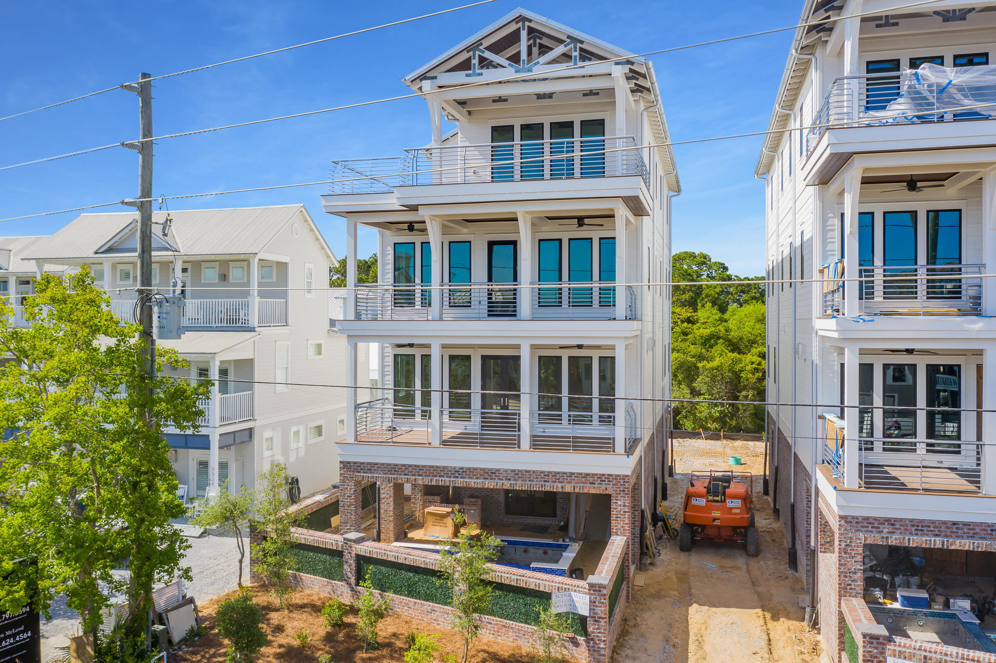 Located in the heart of Seagrove, just a few steps from the Emerald Coast's famous sugar white sand beaches and less than one mile from Seaside, 3325 and 3345 East County Highway 30A combine stunning high-end finishes with commercial-grade structural soundness. Each home contains nearly 6,000 square feet of heated/cooled space and boasts four stories (each with 10-foot ceilings), all connected by a stunning floating staircase. Each of the first three levels contains an open-concept common room and oversized outdoor porch, with exceptional Gulf views from the third and fourth levels. All seven bedrooms, two of which offer custom built-in bunks and two of which are master suites, come with en-suite bathrooms, and two great rooms have powder rooms. Each house comes fully furnished and is meticulously finished with genuine pecky cypress beams and ceilings throughout, quartz countertops, marble tile, high-end engineered plank floors, floating stairs, custom cabinets, and top-of-the-line appliances.

The interior of the home is complemented by unmatched attention to detail on the exterior: oversized porch spaces on each level, highlighted by a large sun deck on the fourth story framed by cypress trusses; an oversized pool / hot tub combination off the front of the house, made complete with lights and a custom waterfall feature, an outdoor grill area, and walled in by a brick and masonry fence to match the brick/masonry exterior of each home's first two stories; paver driveway and parking to the rear; and custom landscaping.

Despite their standard-setting luxury finishes, arguably the most impressive aspect of these homes is what the eye can't see: their structural soundness. Master builder Mike Stinson, who was the chief operator at Yates Construction for over two decades, constructed these homes with commercial-grade materials and concepts. From foundation to rooftop, Stinson's deep background in commercial and industrial construction is evident in these homes, with each designed to withstand ultra-severe weather. Simply put, these are the best-built homes in Seagrove.

From an investment perspective, each home is on pace to produce annual gross rental revenue of more than $350K. When compared to their price points, the resulting investment profiles are among the best along the 30A corridor.

Every aspect of these homes (proximity to the beach and to local dining/shopping, luxury finishes, commercial-level engineering, Gulf views, and ROI profile) is market-leading. Come see for yourself!