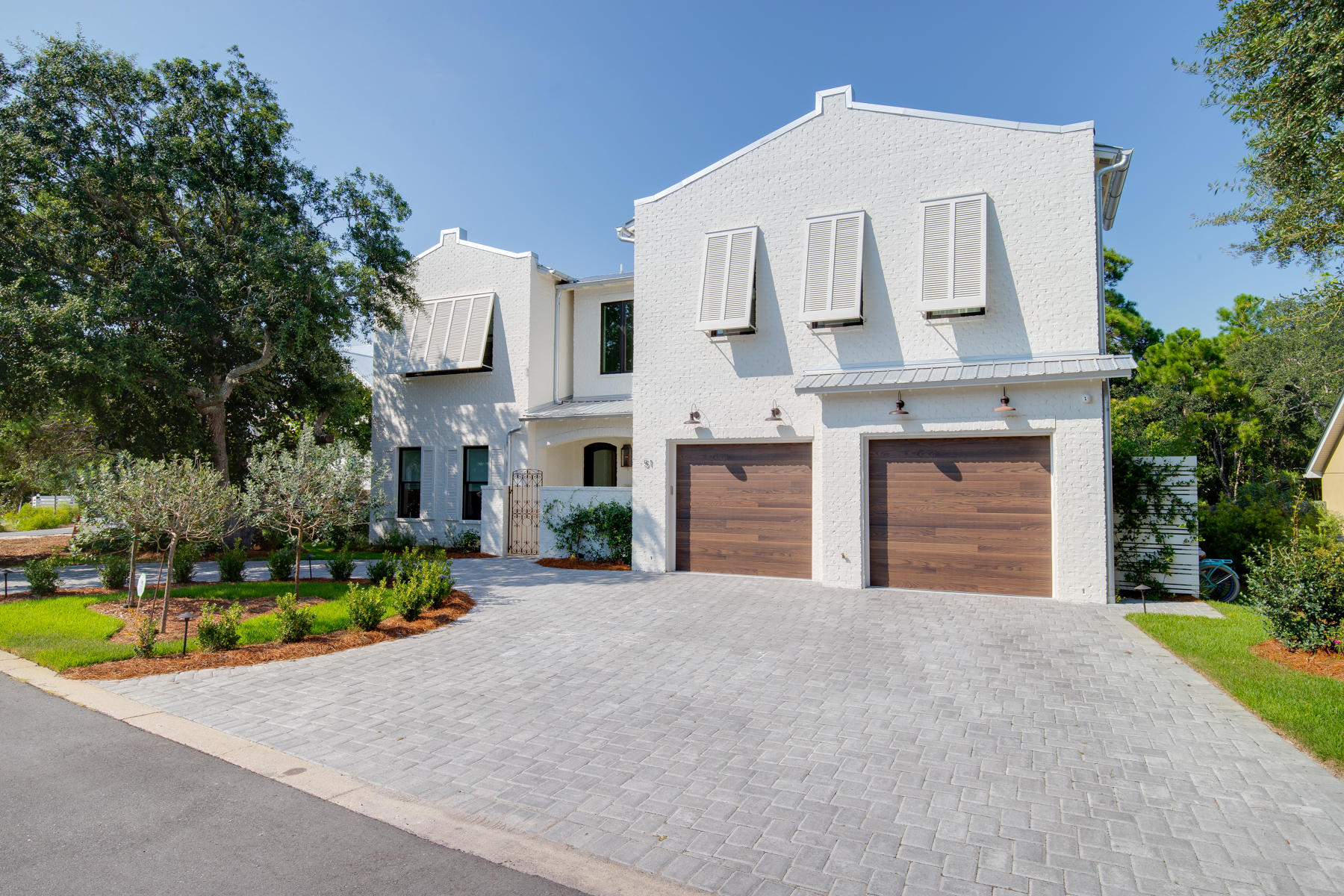 With this STUNNING 5 bedroom 5.5 bath home you can be in the middle of the hot spots like Seaside, Watercolor, Publix, shopping, etc when you want to within minutes by a short bike ride or walk but yet you are in a location where you are completely removed from it.  Having easy access to North/South 395 is a huge plus.  No HOA dues. Impeccable backyard wooded view with no building behind it.  PRIVACY at its best. Home is built for low maintenance.  Beautiful white painted brick that requires no maintenance along with low maintenance yard.  Design of home is open, great to entertain, beautiful doors that open up from kitchen to patio with pool and spacious patio to entertain. Home has great features like wine cellar, laundry rooms up and down, large walk in closets, heated/cooled storage area, easy to maintain concrete polished floors on lower level, steamroom in one bath upstairs, 2 beautiful balcony's overlooking the woods in back, large wet area in Master bath upstairs, all custom baths, indoor gas fireplace, outdoor real fireplace on patio.
Smart home has wifi controlled surround sound, 8 camera (7 outdoor, 1 interior), wifi sprinkler system, wifi hot water system.  This is a home you don't want to miss!