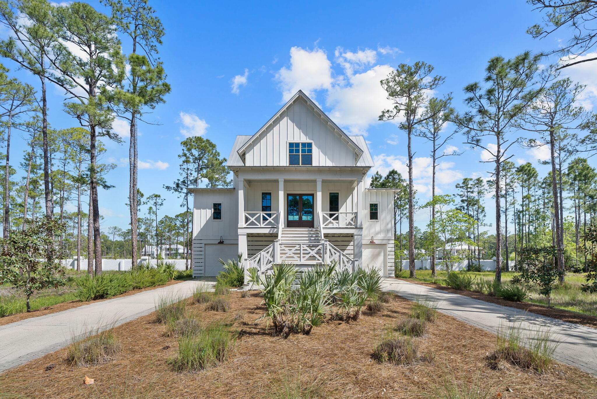 Currently under contract, Seller will accept back up offers. Experience a home that truly embodies all that coastal living really means in this exquisite custom-designed home, just North of Highway 30A. Nestled within the gated, low density community of Cessna Landing, this modern coastal home offers unobstructed water views of the Bay, private community access to the waterfront, complete with a kayak and paddleboard launch, a community pool, and a public boat launch conveniently located across the street. And if you love the sandy beach and turquoise waters of Highway 30A, this home is positioned perfectly to enjoy both - just 3.8 miles directly South and your toes are in the sand! This 4 bedroom, 2.5 bath homes features a stunning entryway and a charming covered porch, perfect for your rocking chairs and watching sunsets. As you walk through the wooden French doors, you're welcomed by 10-foot ceilings, convenient powder room and an open floor plan, perfect for families who enjoy entertaining. The kitchen is fully equipped with Carrara marble countertops, stainless appliances, a Viking gas range, and modern coastal cabinetry. Natural light floods the dining area, creating a warm and inviting atmosphere, while designer lighting enhances the ambiance throughout. The living room offers a picturesque seating area anchored with a cozy shiplap-clad fireplace and is surrounded by full glass doors leading to an expansive southern-style, screened-in porch with breathtaking Bay views. The main-level primary bedroom also has direct access to the screen-in porch and exudes luxury and privacy. This retreat features a large bedroom, walk-in closet, a lavish en-suite bathroom featuring dual vanities with marble countertops, a freestanding tub with a view and a stunning walk-in shower. You will love waking up to Bay views and being only 9 minutes to the sugar white sands each day!

The laundry room is also found on the main level. Adjacent to the laundry room you will find access to the lower level, which accesses the garage are and storage area which is great for kayaks, canoes, beach toys, bikes and so much more. The upper level provides three additional bedrooms with a large full bath providing ample space. One of the bedrooms also features a luxurious, generous-sized, balcony offering sweeping water views. 

Step outside and enjoy a covered patio on the lower level, great for grilling and perfect for additional covered seating overlooking the lush landscaped backyard with cozy firepit. Imagine the memories made here after a day at the community pool or an afternoon fishing off the dock. The lower level can easily be accessed by the screened-in porch making it a great indoor outdoor living experience for all! 

205 Mallard Lane is perfectly positioned to enjoy the lifestyle of a waterfront community while still being within a 9 minute drive to the sandy beaches. The community features underground utilities, natural landscaping for easy maintenance, highly-desirable community pool and dock for water activities. Being in this proximity to Cessna Landing Boat Ramp is also a great amenity for those who wish to fish, boat or enjoy Crab Island year round! This home is a rare find in one of the most sought-after neighborhoods in the area, offering a blend of luxury, convenience, and natural beauty. Don't miss your opportunity to live at the beach, but have the luxury of privacy, serenity and southern charm on 30A!