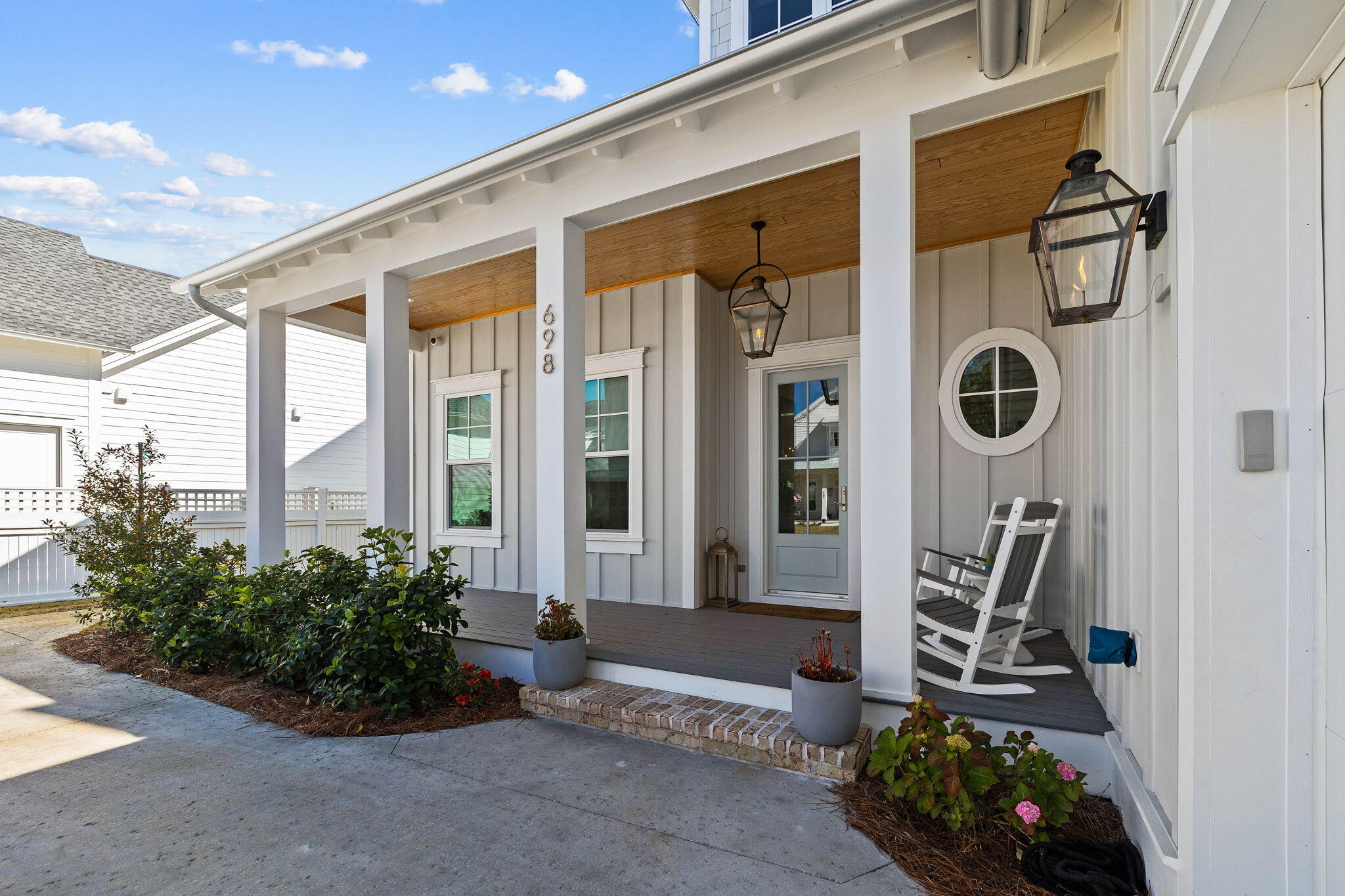 Welcome to 698 Medley, in the highly desired Greenway section of Watersound Origins. This two story, 5-bedroom, 5 full-bath, and 2 half-bath represents the pinnacle of high-end coastal design. The heart of the home is a gourmet kitchen; marble countertops with 3' built up edges, a 36' Wolf dual-fuel range, and a 42' Sub-Zero refrigerator. Culinary enthusiasts will appreciate the custom built glass-enclosed wine cellar with accent lighting. Upgrades added after original sales price include: Whole-home Generac generator, marble tile and countertops, custom built bunk beds, whole-home water filter system, outdoor remote porch screens, custom wine room, custom window treatments/drapery, speaker system, custom limestone fireplace surround, California closets in master closet. * The open-concept living area, featuring 11' ceilings and English Oak hardwoods, flows seamlessly into a custom wet bar with cypress shelves, and marble backsplash. The living room is centered by a limestone-finish Omega mantle and integrated theater system, and opens to two outdoor porches overlooking the pool and spa. 
* Main-Level Primary Suite: A true sanctuary featuring private outdoor access, a spa-inspired Dolomite marble bath with a soaking tub, and an oversized California Closet.
* Versatile Upper Level: Includes two ensuite bedrooms, a dedicated office, and a unique hidden playroom bonus space.
* Guest Carriage Wing: A connected guest retreat above the garage featuring custom bunks, a kitchenette, and a private living area is the ultimate private space.
*Peace of mind is built in with a Generac whole-home generator, a whole-home water filtration system, a comprehensive surveillance system, and two laundry centers; one on each floor.
*Transition through 12' sliding glass doors to a backyard paradise designed for year-round enjoyment that includes:
* Heated Pool & Hot Tub surrounded by a limestone fire pit.
* Summer Kitchen: Equipped with a gas grill
* Powered retractable screens, a custom fenced dog run with direct home access, and an integrated outdoor audio/visual system.
*Located on one of the community's most desirable streets, built by Key Lime Construction, and custom decorated by Lyford Interiors in Fairhope. 
*Enjoy world-class amenities including the Origins Golf Course, resort-style pool, fitness center, and tennis/pickleball courts--all just moments from the pristine beaches of 30A.