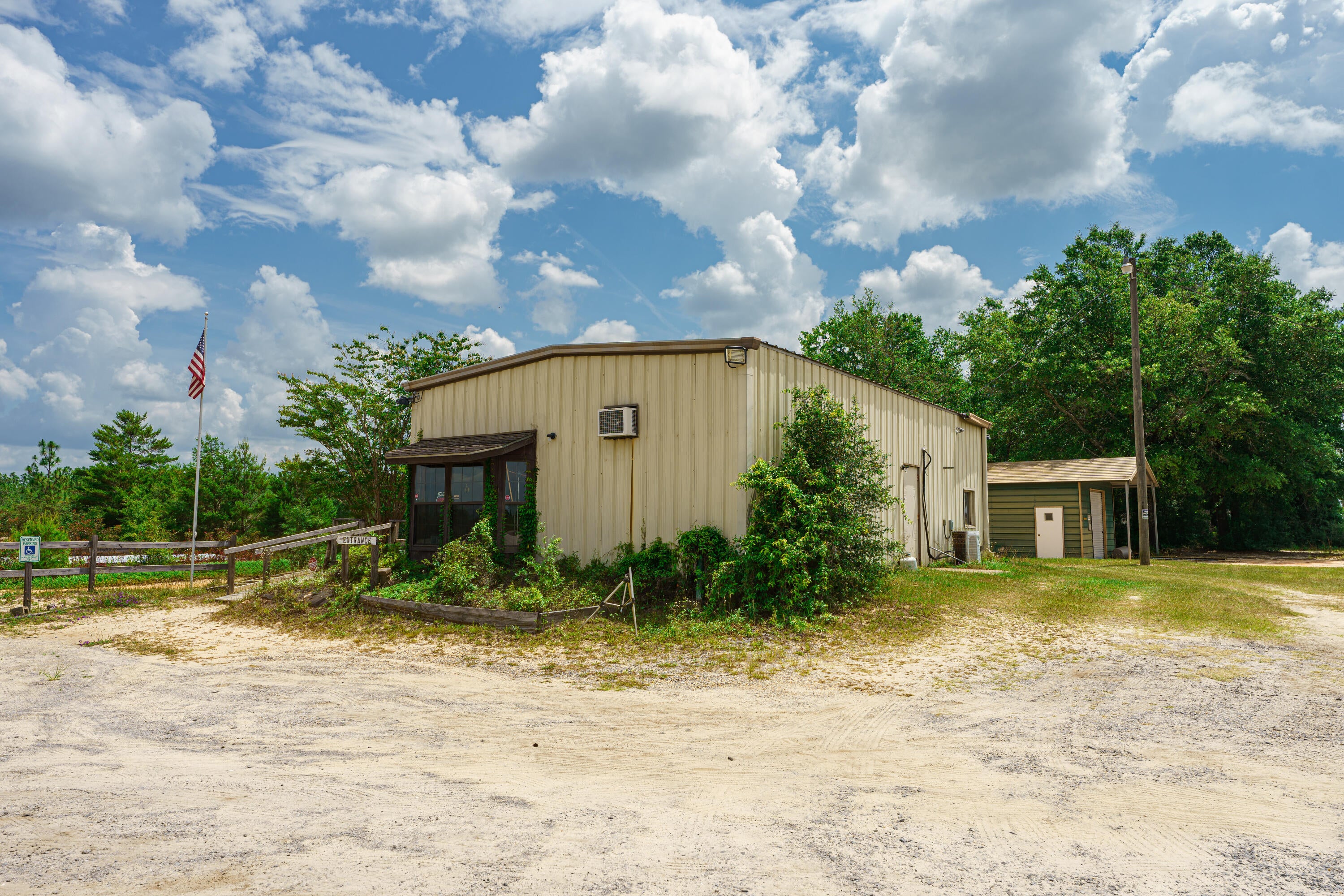 Two parcels make up this 73.7-acre parcel, 7 miles East of Crestview with 1310 feet of highway frontage on Hwy 90E and 7 miles West of the I-10 exit in Mossy Head~ The property is zoned Commercial and agricultural~ It has been a fully operational Gun Range in the past with a 25-yard 12 station pistol range. There is a stream along the back of the property~ FEMA Flood Zone X. The property is just west of Mt Olive Road and across from the Shoal River Ranch which has a one million square foot manufacturing facility being slated for phase 1 completion 2026 which will create more than 330 jobs.  In addition, a new subdivision of approx. 2000 homes is being located less than 2 miles west of this location.
