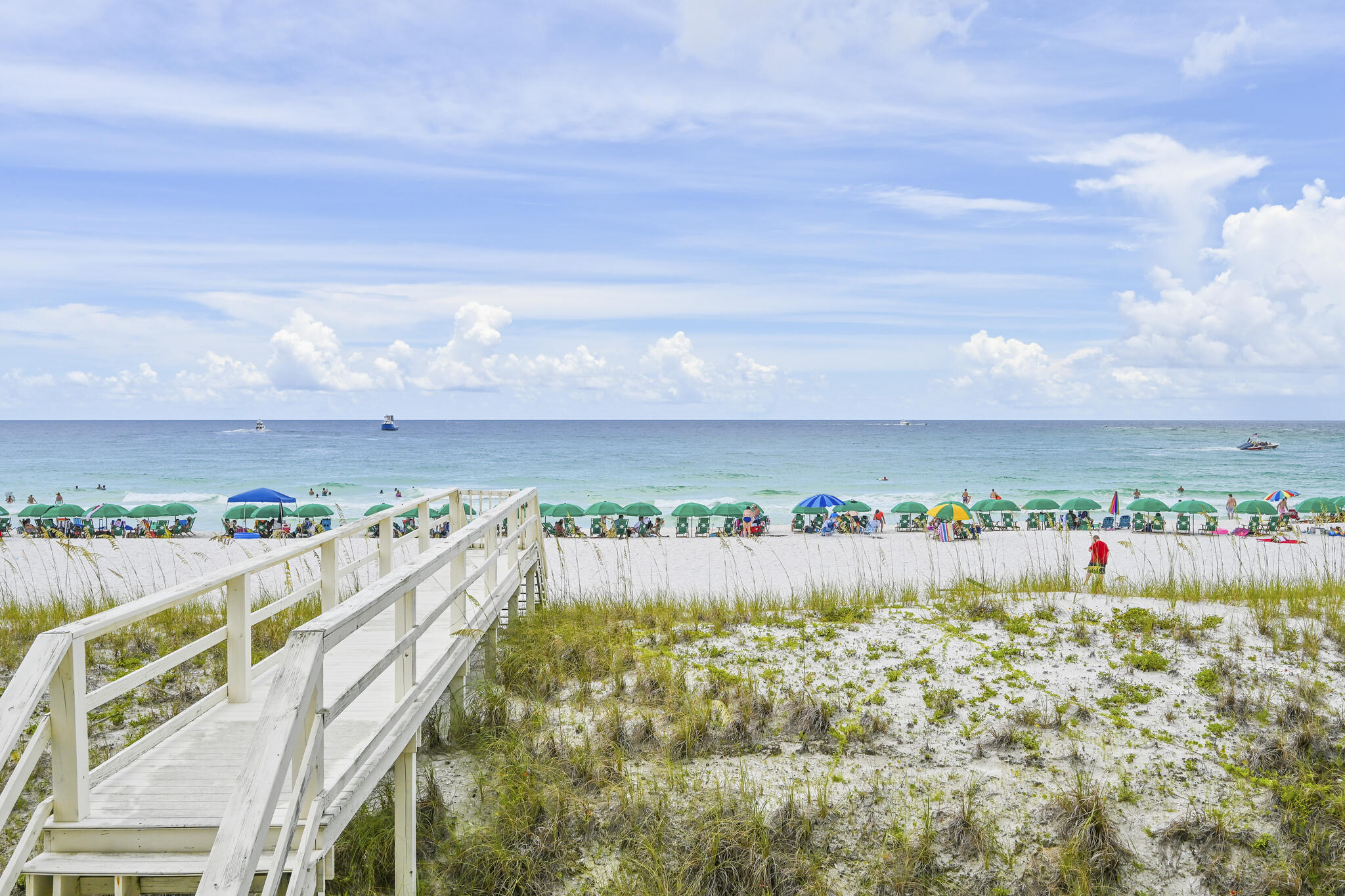 NEW PRICE - Seller is READY to sell! All of the views - Gulf, Beach, East Pass & the Jetties from this GULF FRONT home. Living and Entertaining fun on all three floors with an elevator from the ground floor up – main floor includes the living area, dining, kitchen, half bath, gulf front balcony plus a large bedroom with ensuite bathroom. On the top floor is the primary bedroom & bathroom , gulf front balcony with swing to soak in the views, laundry closet, bunk room for 6, full hall bathroom & guest bedroom #3 with ensuite bathroom & private balcony. The  ground level has a living area with built in bunks, two bedrooms each with their own full bathroom, kitchenette, gulf front covered patio and a two-car garage w/storage. seller is ready to see all offers! New neighborhood pool being built All three floors are accessible by stairs or the ELEVATOR!  There are three HVAC systems with two recently replaced, the stucco was been repaired/caulked, house pressure washed, painted with elastomeric paint, 2nd and 3rd floor balconies have new Trex flooring. Buyer will inherit all deposits made by the current owner since she is no longer able to move forward with her remodel plans - appliances have half deposit made, cabinets are paid in FULL and will be delivered to the house & plans are provided with contractor's estimate. This second owner residence is located in the premier gated community of Destin Pointe on Holiday Isle.  Amenities include two pools, two lighted tennis courts, shuffleboard, lakes and private gulf walk over & access to over 3000 feet of white sand beaches. Close by is everything offered by Destin Florida -  shopping, dining, boating, fishing and local entertainment.