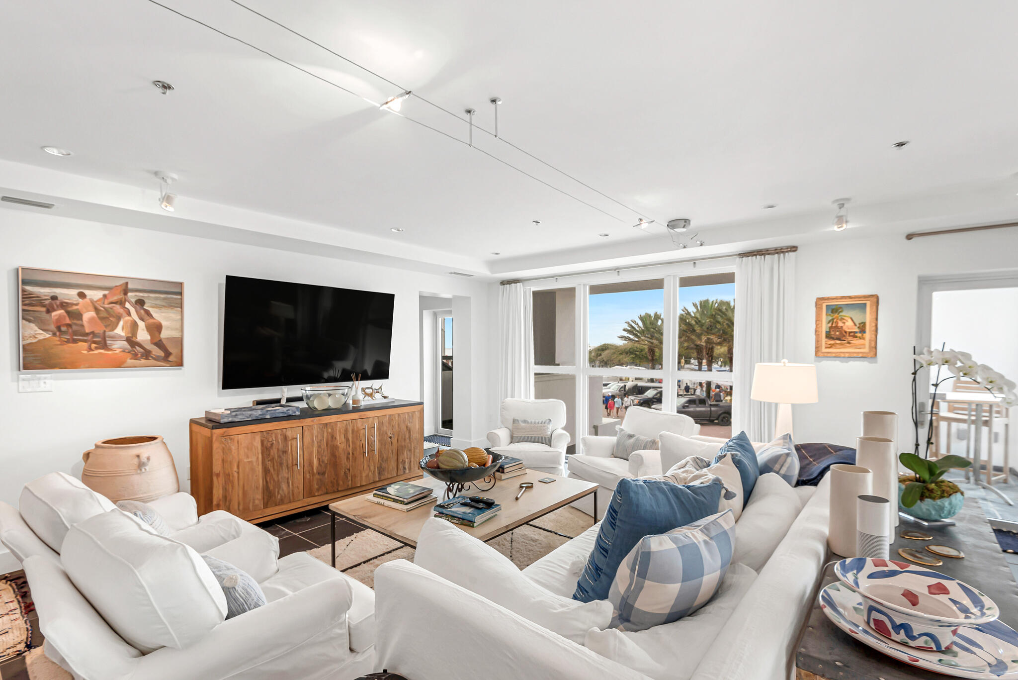 This stunning and spacious 2Bd, 3Ba luxury condo with hallway bunks is located in the heart of one of the most sought-after communities on the Emerald Coast, Seaside. It's situated on the main town circle next door to the adorable and iconic Seaside Post Office and sits above the ever popular, Modica Market. It boasts of custom built cabinetry in the kitchen and has beautiful designer finishes throughout. Combine this with stylish, yet comfortable, furnishings and you get effortless style and a relaxing environment. A private elevator takes you to and from the residence through the secure lobby which is conveniently located directly in front of a dedicated parking space in the back of the building. Not only is this condo in the heart of everything desired, but it offers Gulf views from both second story balconies while also overlooking the arts and entertainment that the Seaside Amphitheater has to offer! There is also a convenient storage area for your bikes & beach toys located on the ground level. Comfort and style abound in this open and spacious unit with plenty of room to accommodate family and friends for gathering and entertaining. The location, views and proximity to shopping, dining, entertainment, not to mention the beach, makes this a perfect second home or investment opportunity!