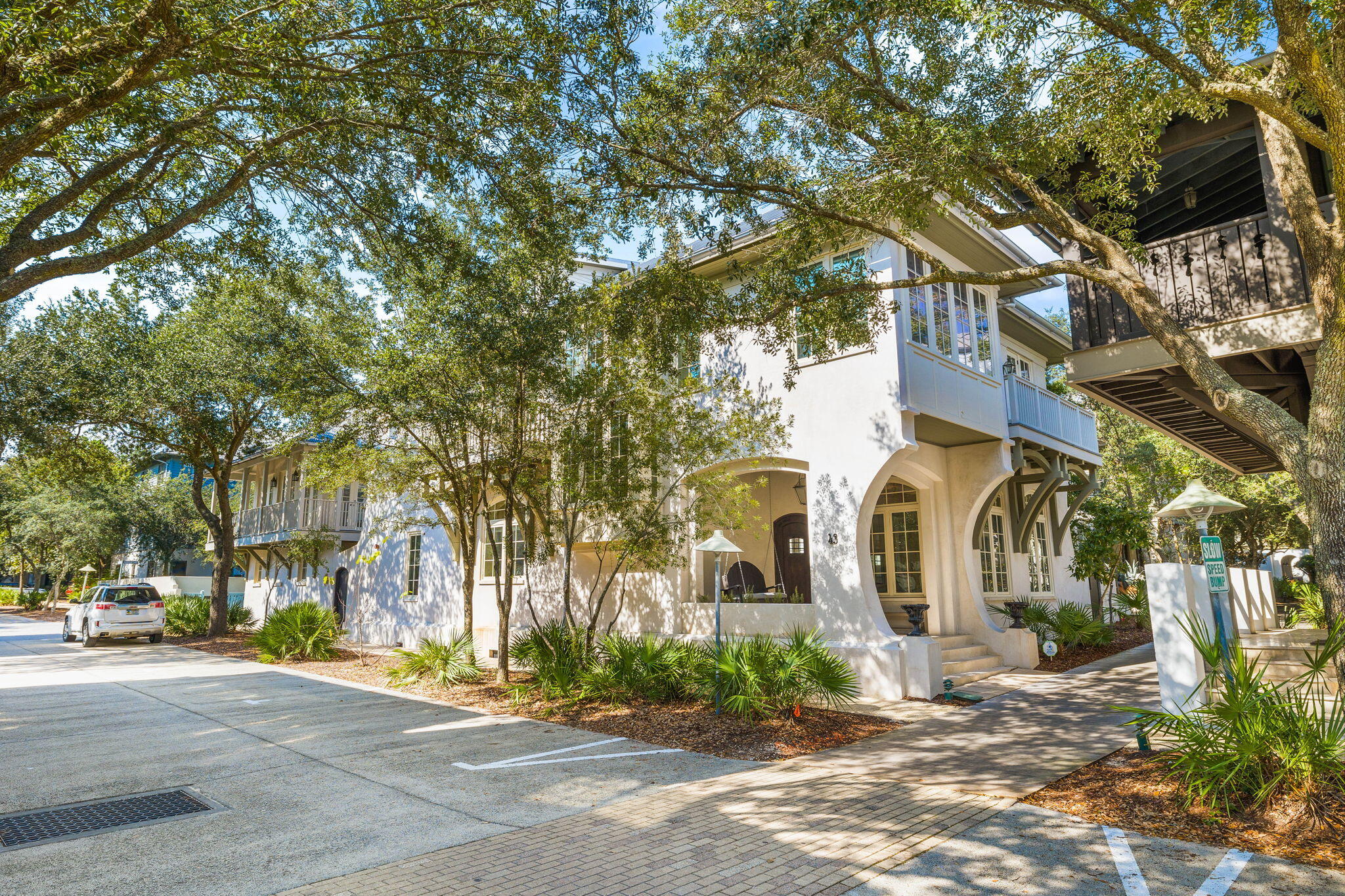 Relax and entertain in this recently redecorated home on an oversized corner lot in Rosemary Beach. 43 E Water Street is a 6 bedroom, 5 bathroom private retreat featuring a large main house and a carriage house. There are beautiful oak floors throughout with gorgeous, tumbled marble in every bathroom. The main house has a welcoming front porch with a swing that is perfect for relaxing mornings to people watch. Entering the open concept floor plan is like a breath of fresh air. The den has soaring coffered ceilings with custom molding, a beautiful, oversized limestone gas fireplace, and lots of windows for magnificent views and light. The super large chef's kitchen accommodates a crowd with Wolf and Subzero appliances, butler's bar/pantry with ice maker, coffered ceilings, oversized island, wine cooler, lounge seating area and granite countertops. Making room for lots of cooks in the kitchen and the place where all parties end! Also featured on the main level is a guest queen bedroom with views of the pool and a full bathroom just across the hall. In addition, a spacious office with custom built-in filing, shelves, and desk offers a haven for those that need space to organize and get work done.

The second level hosts the spacious King master suite and features a seating area, large bath with walk-in closet and private balcony. Also on the second level is an additional King guest room and the bunk room that has twin over twin bunks with an additional trundle. There is a Jack and Jill bathroom for these rooms that feature two separate vanities for accommodation. The spacious laundry room has generous storage and folding area along with a built-in ironing board.

The carriage house has a seating area, dining, and kitchen with new refrigerator and range. The master queen bedroom includes an ensuite bathroom. The interior spiral staircase leads to a bunk room with four twin beds and a full bathroom. The carriage house also features a wrap-around exterior balcony. The carriage house has a 2-car garage with a laundry room and storage. A third off street parking area is covered by an arbor.

The property features an outdoor lounging area that is sure to please, with gas grill, outdoor gas fireplace, heated pool, and lush landscaping. The home is easy walking distance to the Homeowners pool, Cabana pool, coffee shops and beach. The home was built in 2007 by Benecki Fine Homes who is very well known for fantastic custom homes. The property is being offered fully furnished as seen in the attached photos and sure to be a stellar rental property or second home.