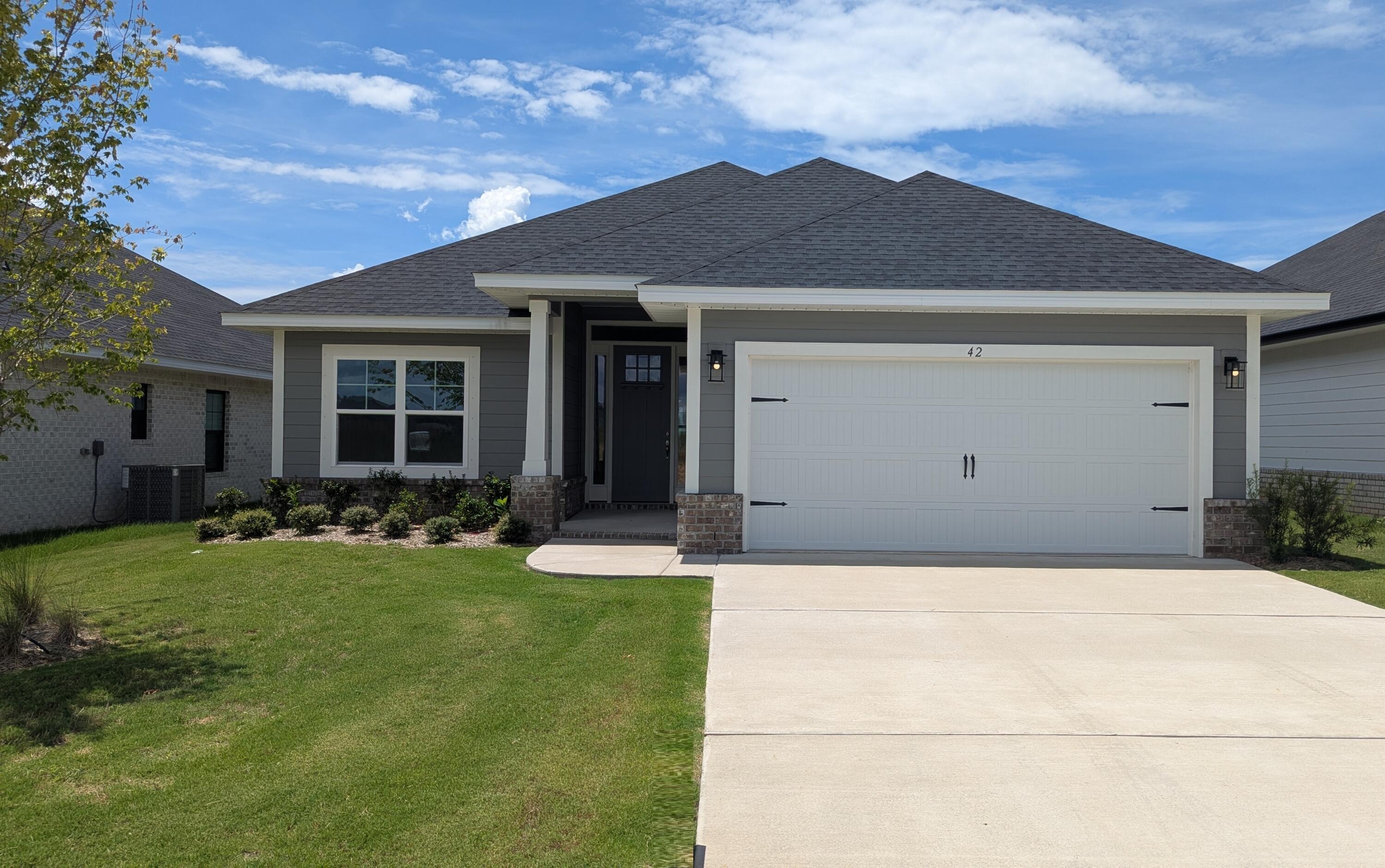 Limited-time offer: Receive up to $35,000 price discount on this home. Ask about our 3.99% interest rate buy down promotion with our preferred lender. Community also has USDA financing with zero down payment for those that qualify.
Just a 20 minute drive to South Walton beaches & 30A! Popular Craftsman 4 BR/2 BA home with Hardiboard siding and brick skirt. LVP flooring throughout.  Cathedral ceiling in main living area, all ceiling heights are 9' or higher.  8' entry doors, Quartz countertops.  Owner's Suite has a large walk-in closet. Owner's Bath has garden tub + separate shower, undermount sinks and dual vanities. Fully sodded yard w/ Sprinkler system & garage door opener. *Furnished pics are like plan but selections or features may be different than actual home for sale.*