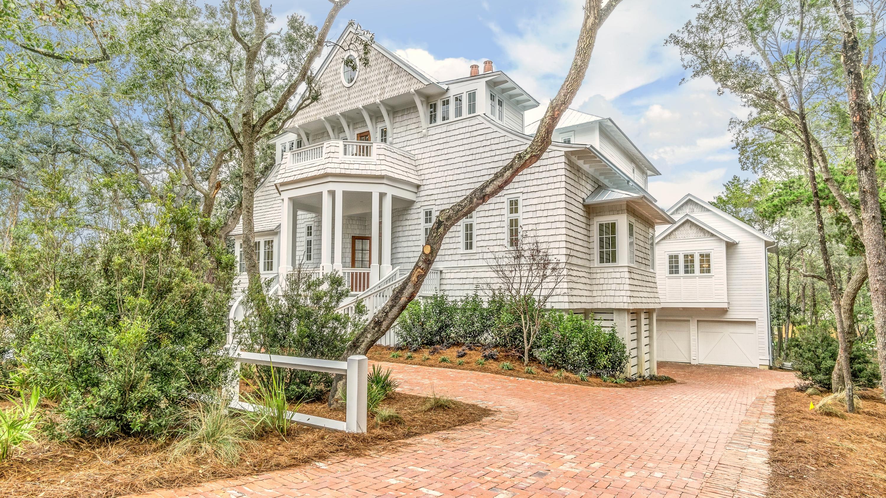 This spectacular old Seagrove Estate is a world unto itself--masterfully blending coastal luxury and sophistication with the wild natural beauty of Seagrove Beach, mere steps to SEASIDE, FLORIDA and the beaches of 30A. A symphony of wood, glass, and stone, the home's design, materials, amenities and craftsmanship are peerless. The expansive residence includes 7 bedrooms, 8 bathrooms, a bunk room, 4 family gathering rooms, 3 laundry rooms, an elevator and a lavish carriage house for guests. The chef's kitchen with custom cabinetry and lighting and high-end appliances is perfect for the cook in your family. The two-story great room includes a cozy fireplace for cool beach night, offering the perfect location for your next soiree or family gathering. Creating an excellent flow for entertaining, the residence opens to a spectacular terrace around the beautiful pool and outdoor fireplace to offer a true outdoor living space. The oversized lot offers homeowners privacy and sufficient parking for up to 12 vehicles. Home is offered professionally decorated and furnished!