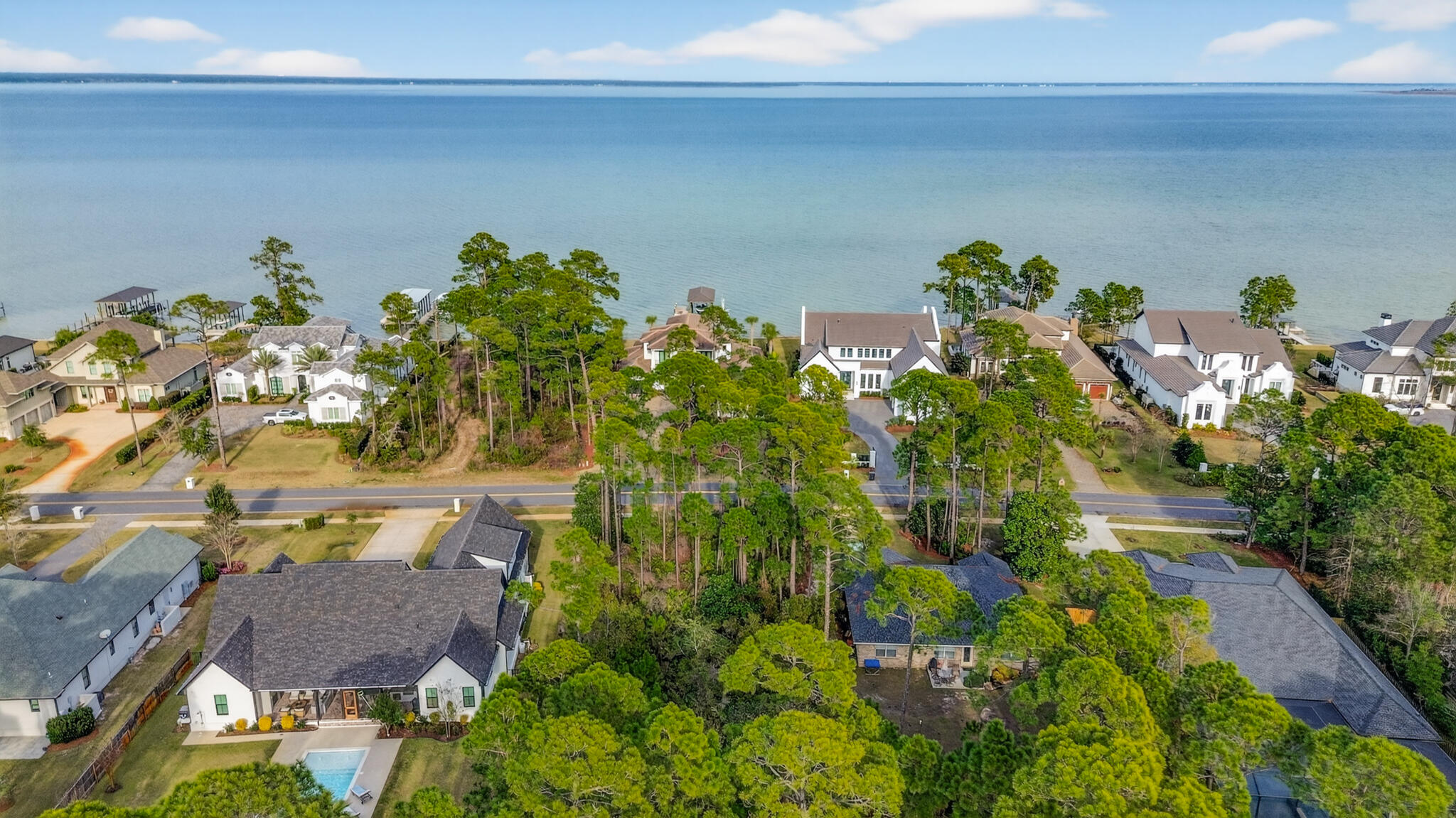 The vision is already drawn, and all that's missing is your name on the mailbox. This lot comes with house plans, already finished if you want to utilize them.

This is a rare opportunity to secure a homesite in Driftwood Estates, one of Santa Rosa Beach's most established and picturesque bayfront communities. This exceptional lot offers something luxury buyers value most: tranquility. Completed architectural house plans are included, allowing you to bypass months of design time and move confidently toward construction.

Surrounded by beautifully crafted custom homes and mature coastal landscaping, Driftwood Estates delivers the refined neighborhood feel that's increasingly hard to find along the coast. Residents enjoy a private community pool, parks, playground, and gathering spaces, all contributing to a relaxed, upscale lifestyle just moments from the bay and the all contributing to a relaxed, upscale lifestyle just moments from the bay and the area's world-class beaches.

With paved roads, a well-maintained setting, and a reputation for quality homes, this property offers the perfect foundation for a distinguished custom residence. Whether your vision leans modern coastal elegance or timeless Southern architecture, the groundwork has already been laid.

Build the home you've imagined, without the typical delays.