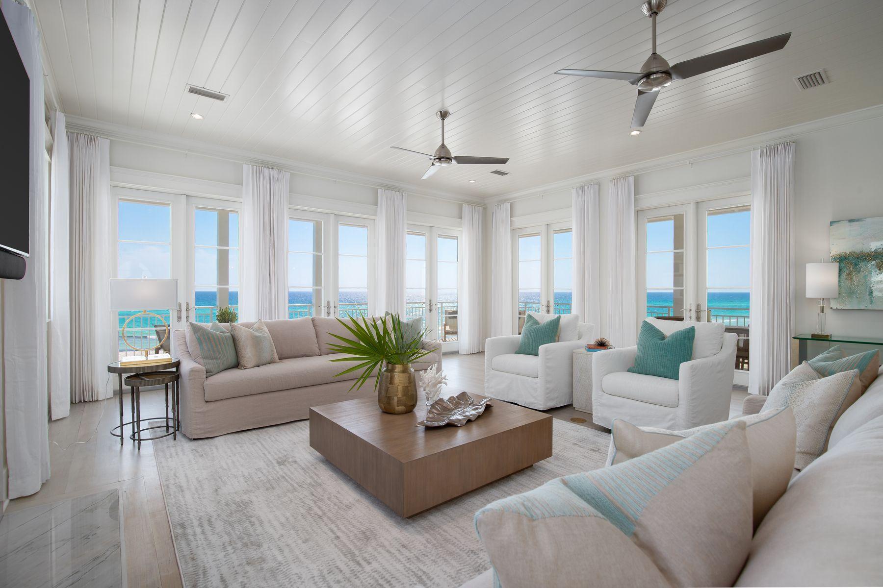 This beautiful gulf-front beach house is an outstanding bespoke property enjoying an incredible position on 0.69 acres. With 61 feet of coveted beach frontage and a depth of 467 feet, this one-of-a-kind property extends to the high water mark with a private gated walkway providing easy access to the white sandy beach. The peaceful location, on a road with no through traffic, can be enjoyed from porches on all three levels. A wrap-around balcony provides boundless views of the sparkling emerald Gulf and Eastern Lake, just behind the property. There's ample space for dining, relaxing and outdoor entertaining on the spacious deck surrounding the gulf-front heated pool. Steps lead down to the undulating dunes with waving sea grass and the stunning beach beyond. Fully refurbished by Davis Dunn Construction, this awesome home has an attractive floor plan and dedicated space for every activity including a den, built-in bunk room and a huge family room at pool level. The home offers State-of-the-art electronics, an elevator and a comprehensive security system. Interior design is curated by Laura McKee at Dwell. On the top floor, French doors frame stunning views while unique ceilings add to the charm. The main sitting room is equally bright and attractive with a feature fireplace and windows delivering multi-aspect vistas. As you would expect, the kitchen is both stylish and practical with a long bar for serving up snacks and cocktails at the appropriate hour. If all this is not enough, architectural plans are available to add a two bedroom, two bath carriage house accommodation for independent living above the two-car garage. With its tropical landscaping and beachfront position, this fabulous home has all the appeal of a castaway island yet is within easy reach of Seagrove Beach amenities, restaurants and shops at WaterColor, Seaside and surrounding areas. It's definitely the best of both worlds.
