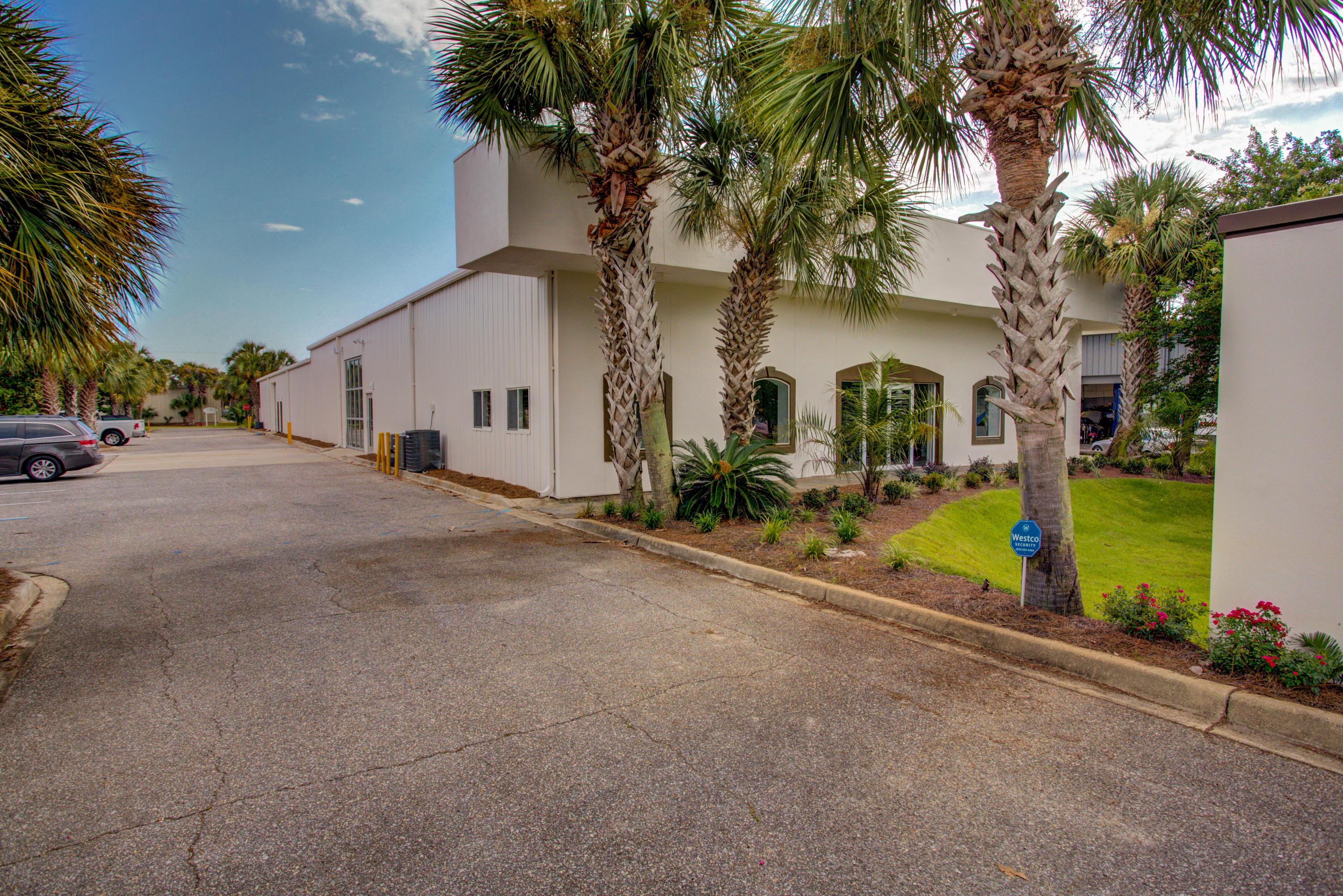 Prime commercial parcel located in Destin, Florida's industrial district, offering fantastic logistical orientation to the area's main vehicle thoroughfares and within a mile to the private airport.
The approximate .84-acre site has exceptional ingress and egress, with 120' fronting Airport Road, as well as 120' to the rear on Industrial Park Road, featuring a loading dock.
The site is zoned IN (Industrial) through the City of Destin, located in Okaloosa County.
Measuring over 12,000+ SF and originally constructed in 2001, the building has undergone a substantial renovation to accommodate its new credit-rated tenant, Xator Corporation, a national security concern involved in global operations. The modernized interior and its layout consists of a main floor and mezzanine level... The main floor is comprised of a spacious lobby with two bathrooms, six offices (the largest executive office features a lavish full bath), two conference rooms, a break room, IT room, an expansive "bullpen" enjoying significant ceiling volume and accommodating adaptable cubicle configurations, serviced by a beautiful kitchen and work island. The floorplan flows into a warehouse and flex space which contain two additional bathrooms and a loading dock with canopy and two commercial-grade roll-up doors. The mezzanine level could accommodate expanded workspace, seminars, game room, exercise room, storage, etc. The initial term of the lease and rent commenced on April 1, 2018, and shall terminate on March 31, 2023, unless tenant exercises optional renewal terms allowing for two (2)-year and one (1)-year additional extensions.
The minimum base rent is $204,000/annually under net lease terms, further offering an investor 3.5% annual escalations.  Please inquire for further details.  Showings must be accompanied by listing broker and are by appointment only.