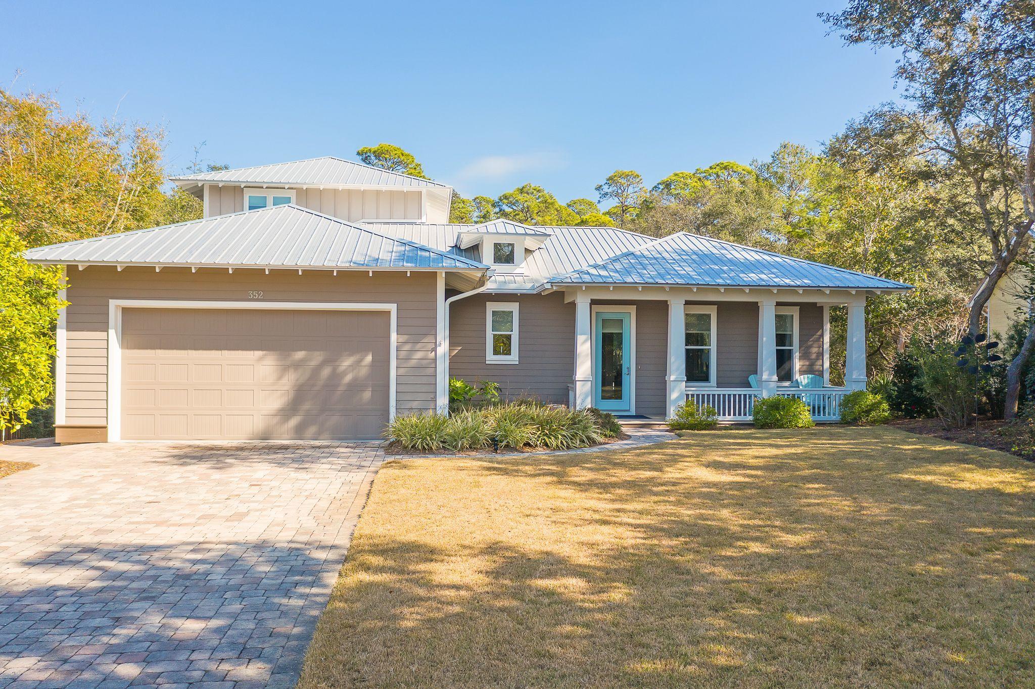 This 4 bedroom 3.5 half bath home built in 2015 with 3,339 total square footage is located in the nonrental 30A neighborhood of Seabreeze on over a half-acre private lot with mature oak, magnolia and palm trees and backs to a creek. The grounds are meticulously landscaped and include a well/pump and irrigation. The property has a paver driveway, walkway and patio, and a large lanai with a pool plus has an oversized two car garage. There is also a large storage area underneath the home, so there is plenty of storage space for bikes, kayaks, paddleboards, beach chairs, etc.  The home has a 22KW whole house generator that is under warranty until 2028. This is an energy efficient home with spray foam R-13 insulation in the outside walls, spray foam R-14 insulation in the subfloor and spray foam R-20 insulation in the roof , two 14 Seer heat pumps and a tankless hot water heater. The average electric, gas and water bill is $200/month.  The home offers 10 foot ceilings, 7 ½ inch trim, crown molding, recessed lighting, ceiling fans and antique Java bamboo flooring.  This bamboo flooring is the world's hardest floor and each plank is meticulously hand scraped for a naturally aged look and feel and has a 50 year residential warranty with a 10-coat scratch resistant finish. The home has a light and bright open floor plan with ample windows allowing you to overlook the beautiful screened lanai and pool area. The large lanai offers additional outdoor living space, al fresco dining and is a grillers paradise allowing you to enjoy the natural serene surroundings and open-air living at its best! The living room has both a gas fireplace and floating shelving. The kitchen offers stainless steel appliances to include a LG refrigerator, LG dishwasher, GE microwave and double gas oven, blanco sink, lighting under the cabinetry, a large center island with a prep sink, trash bin drawer and a large pantry with wooden shelving.  The kitchen opens into the dining area and both overlook the lanai and pool.  The first floor laundry room is conveniently located immediately off of the garage entry. This home has the coveted first floor master bedroom. This large room offers huge his and her walk in closets with custom wooden shelving. A double vanity, stand-alone shower with a tile accent wall, soaking bathtub also with a tile accent, water closet and open wooden linen shelving complete the master ensuite which has a door for entry to the lanai and pool. An additional bedroom (which is currently being used as a craft/hobby room) is also located on the first floor along with a half bath conveniently located just off of the lanai. There is also a large storage closet under the stairs. Two additional bedrooms are on the second level of the home. Both of these bedrooms have massive walk in closets and their own ensuite baths.  All this plus the Seabreeze community has a private deeded beach access along with access to Camp Creek.  This home truly allows you to enjoy all that this area has to offer!  This size lot is few and far between.  The property is a must see!  Your private oasis awaits, call to schedule a showing today!