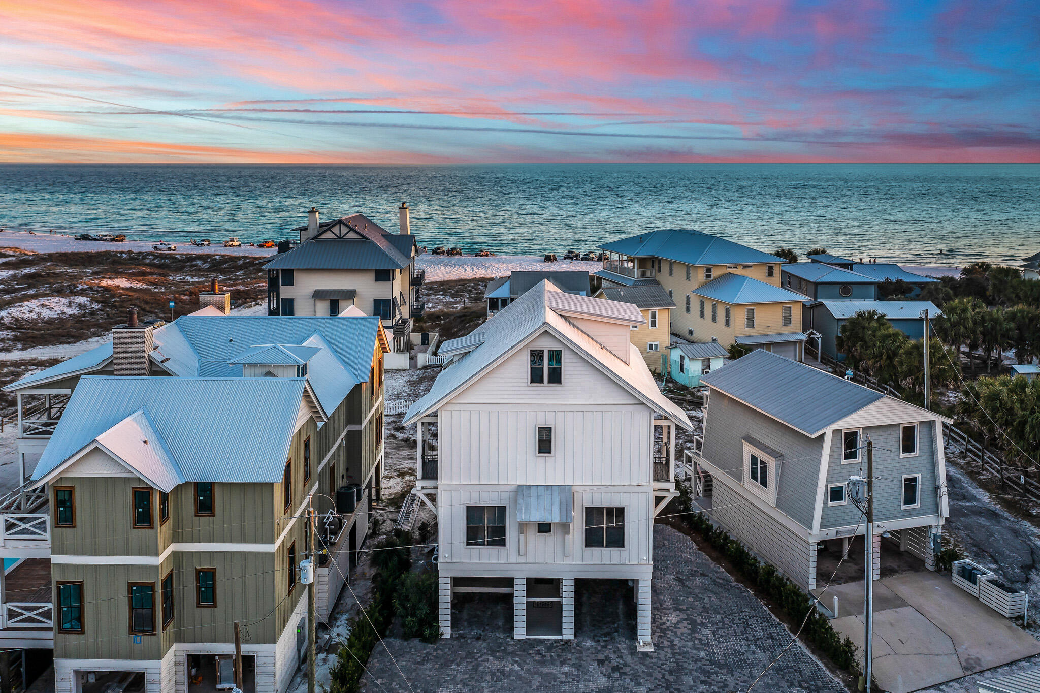 Aptly named ''Dawn Patrol'', grab your surfboard and be the first one to the beach every morning from this perfectly positioned Grayton Beach home. Designed by Geoff Chick and built by Corbin Ousley of CC Ousley Building Company, Dawn Patrol features 7 bedrooms, 5 bathrooms, gulf views & living areas on all three floors, an elevator, a private pool, parking for 8 vehicles, & just steps to the beach. Meticulously maintained and currently operated as a vacation rental ($360k revenue in 2021), Dawn Patrol is perfectly suited for a full-time family or can continue to operate as one of the top rental producers in Grayton Beach. Step out your front door and take a casual stroll around downtown Grayton Beach. Walking distance to the best restaurants on 30A - The Red Bar, Chiringo, Hotz Coffee, Borago, Hibiscus, AJ's, Grayton Seafood Company, Hurricane Oyster Bar, Chanticleer, Black Bear, Nanbu, Roux 30A, Grayton Corner Cafe, Crackings, Grace Pizza, Badass Coffee, etc. Come see why Grayton Beach is currently ranked the #1 beach in the United States by Stephen "Dr. Beach" Leatherman.