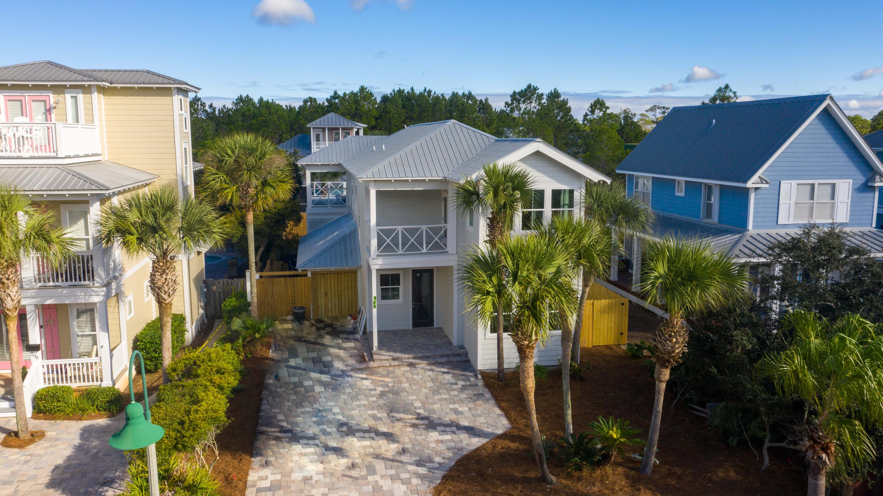 Perfect for Investors, second home, or full time living.  This is your dream beach house in the heart of Seagrove. Less than five minute walk to the beach, restaurants, and shopping. This newly renovated home from the frame up has it all., to exceed your expectations. Living area and kitchen is open floor plan to host any type of gathering for vacation or family get togethers. This property has a large living area with 6 bunks,, kitchenette, and TV and would be perfect for a private family on vacation. Master on first and second floor. Upstairs master has a sauna.  The 2nd floor back of  the house has a huge magnificent  entertainment deck the width of the house. This is under a  cathedral ceiling with fans, flat screen tv, sink, cooler, and ice maker for those football games and gatherings. There is plenty of room for sun bathing. This area overlooks a back yard oasis, with pool spa with fountains, pavers, and landscaping for those endless days and nights of entertaining.  There is covered parking and hook-up  for your golf cart for getting around the beach towns of Seagrove and Seaside.This beach house has all the amenities of a newly built home. Both masters have ensuite bathrooms, showers with rain heads, double vanities, soaker tubs, and  sauna in upstairs master. Kitchen has all new stainless  appliances, farm sink, pot filler, gas stove, and quartz waterfall island. The builder didn't forget 3 ac units for those hot summer days and two tankless water heater systems for endless hot water. House has indirect stair lighting  and smart lighting so you can set for different moods. House is totally furnished with all coastal furniture by Sugar Beach Interiors,  and new tv's in every room. If you are looking for a beach home, this checks all the boxes. You will love the entrance, with its paved driveway, which holds four cars, plus beautiful palm trees, porch and balconies, and gas lantern. The house just says "I am on vacation and forget everything".