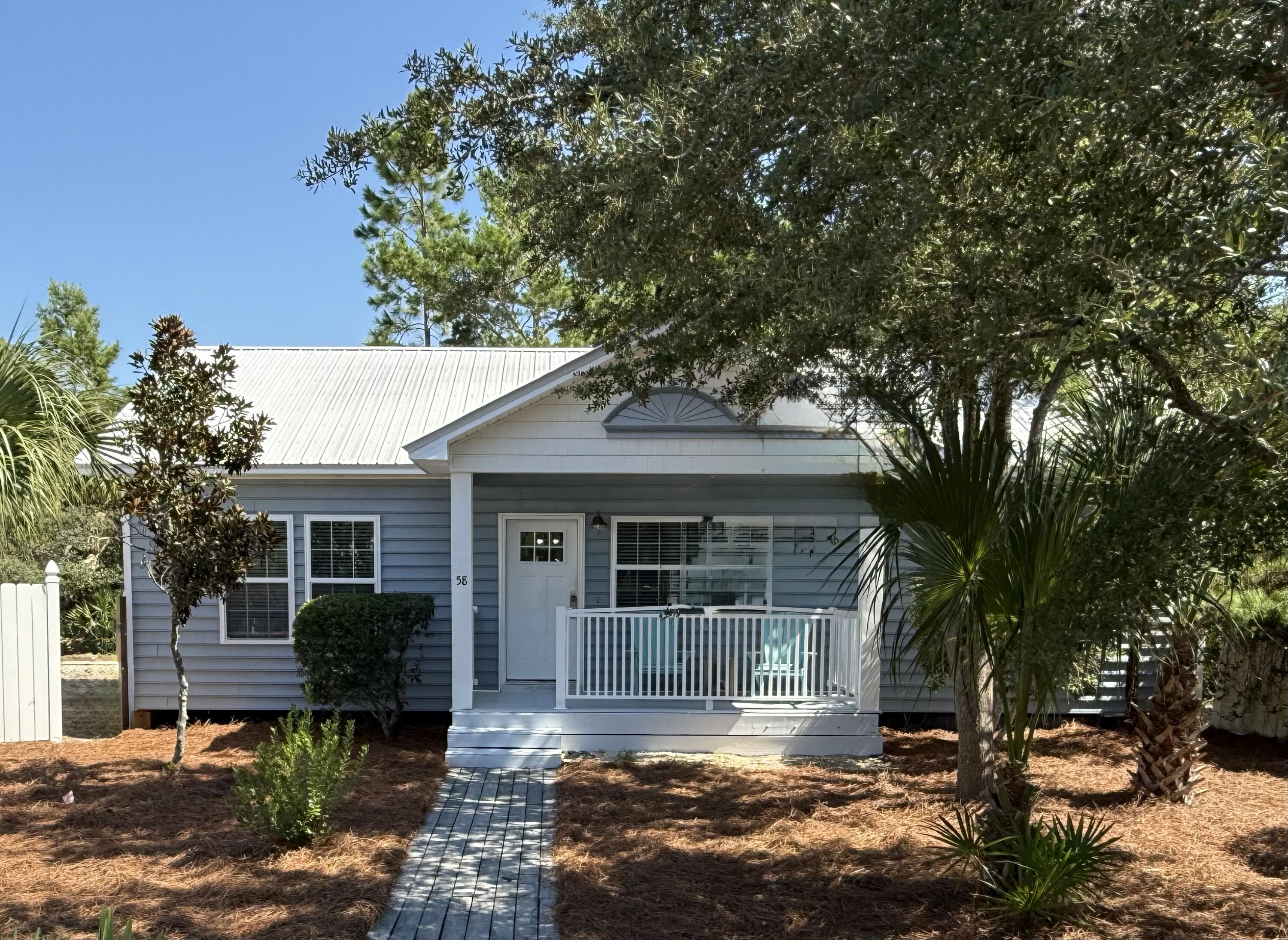 New Year New Price!!! This charming, remodeled beach cottage located in the heart of Seagrove Beach in the small Gulf Cove community is only three blocks from Hwy 30A and multiple beach accesses.  With vaulted ceilings and an open concept living space, fully equipped kitchen with a breakfast bar that overlooks the dining and living area makes relaxing and entertaining a delight.   The owner's suite has a king bed, large closet and en suite bath. The guest bedroom has a queen bed and the third bedroom has a set of twin bunks.  The cottage overlooks the private community pool that is perfect for lounging, swimming or using the communal grilling area.   This three-bedroom, two-bath home is rental-ready.  Walking distance to the beach, Cafe Thirty-A, Angelina's Pizzeria & Pasta and many other 30A restaurants and attractions favored by residents and vacationers alike make this an ideal rental property or second home. Sold fully furnished.