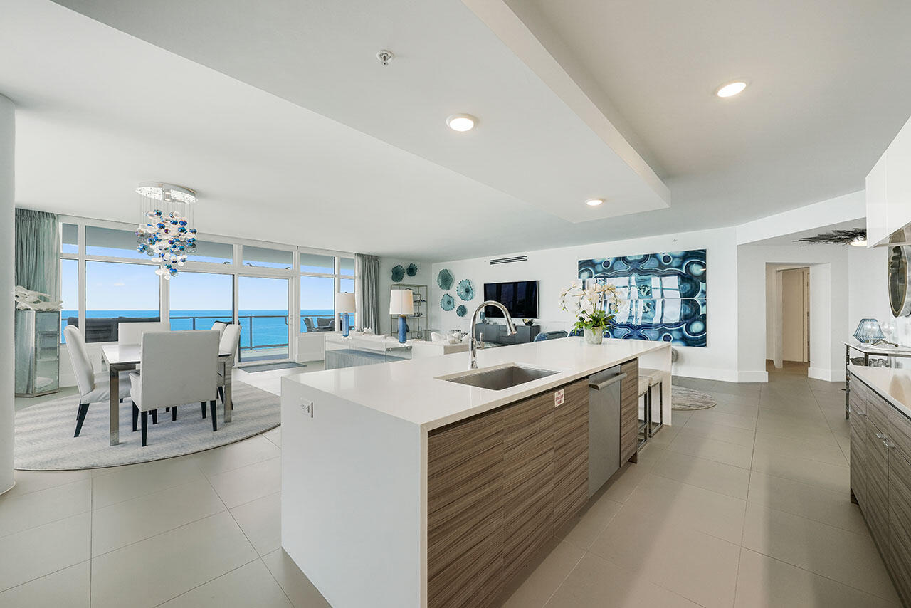 Experience panoramic views of the sea and sky at 1900 Ninety Eight 901. Destin's luxury high-rise doesn't disappoint. This 9th-floor luxury condominium offers spacious living spaces, world-class amenities, and gorgeous views of the Gulf of Mexico. This 3 bedroom and 3 bathroom residence is located in the heart of Destin, making it easily accessible to dining and entertainment options.

The open floor plan inside 1900 Ninety Eight 901 allows for natural light to fill every inch of the kitchen, dining, and living room. Facing the East, coastline views can be admired for miles along the expansive wall of windows. Access the views with the touch of a button, the blinds throughout this residence are remotely controlled for simplified living. The kitchen boasts Thermador appliances, quartz countertops, and custom cabinetry. 

The living room is beautifully designed with coastal decor and luxury accents. Enjoy a movie from the sofa or admire the views of the Gulf from this space. Prefer to sit outside? The balcony is easily accessed from the main living spaces where guests are welcomed to a spacious balcony with glass railings to enhance views of the Gulf. 

With three bedrooms, there is no shortage of sleeping arrangements at 1900 Ninety Eight 901. The master suite is found on the West side of this residence and designed with pure luxury in mind. Expansive windows allow for natural light to fill the entire room. The spa-like bathroom has double doors that open up towards the Gulf to allow the sunlight in. Soak in the freestanding bathtub or shower off in the walk-in shower. This master bedroom will transport you into an oasis. Three additional bedrooms are found on the West side of this residence. Both a king bedroom and queen bedroom offer en-suite bathrooms and spacious closets. The final bedroom is perfect for an office and acts as a bonus room with views of the Gulf. 

Additionally, this condominium offers an in-unit laundry room with both a washer and dryer. Amenities at 1900 98 Condo include a state of the art fitness center, a rooftop pool, a spa, and a fire pit. 1900 Ninety Eight 901 is the perfect residence for a Destin vacation. With the exquisite amenities and close proximity to shopping and dining, guests can enjoy everything the Emerald Coast has to offer.