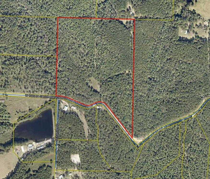 Nestled in the peaceful countryside of North Walton County, this stunning 48-acre wooded property offers the perfect blend of privacy, natural beauty, and convenience. With a meandering creek running through the land, you'll enjoy a serene setting ideal for fishing, exploring, or simply relaxing by the water. The property sits on a paved road, providing easy access while still maintaining a secluded feel surrounded by mature trees and abundant wildlife. Whether you're dreaming of building a private retreat, creating a family homestead, or investing in recreational land, this property offers endless possibilities to embrace the best of Northwest Florida's outdoors.
