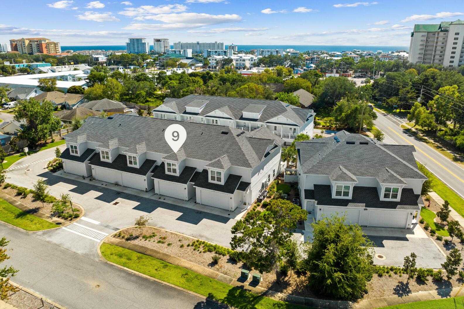 This thoughtfully designed Beach Lofts townhome offers the ideal blend of comfort, space, and convenience in the heart of Destin. With approximately 1,758 square feet, the home features an easy open concept main level where the spacious family room flows through double doors to a covered patio that is perfect for morning coffee, evening breezes, or casual entertaining.

The kitchen is bright and inviting with white cabinetry, stainless steel appliances, plenty of storage, and a large center island with seating. A half bath on the main level adds everyday convenience. Upstairs, all three bedrooms are positioned together, including a generous primary suite complete with a cozy window seat, large walk in closet, and a private ensuite bath featuring a double vanity, tile shower, and water closet. The two additional bedrooms share a well appointed hall bath with a double vanity and shower and tub combo. Both rooms open directly onto an upstairs covered patio overlooking the pool, creating a relaxing retreat just steps from your bedroom.

The location is a standout for everyday living. Beach Lofts sits minutes from Destin Commons, HarborWalk Village, local restaurants, grocery stores, and the emerald waters that make Destin famous. Quick access to Highway 98 keeps daily errands and commutes simple with easy reach to surrounding communities and major conveniences. Whether you are looking for a full time home, a personal coastal getaway, or a residence with the option for long term rental flexibility in the future, this Beach Lofts unit offers comfort, style, and a prime location along the Emerald Coast.