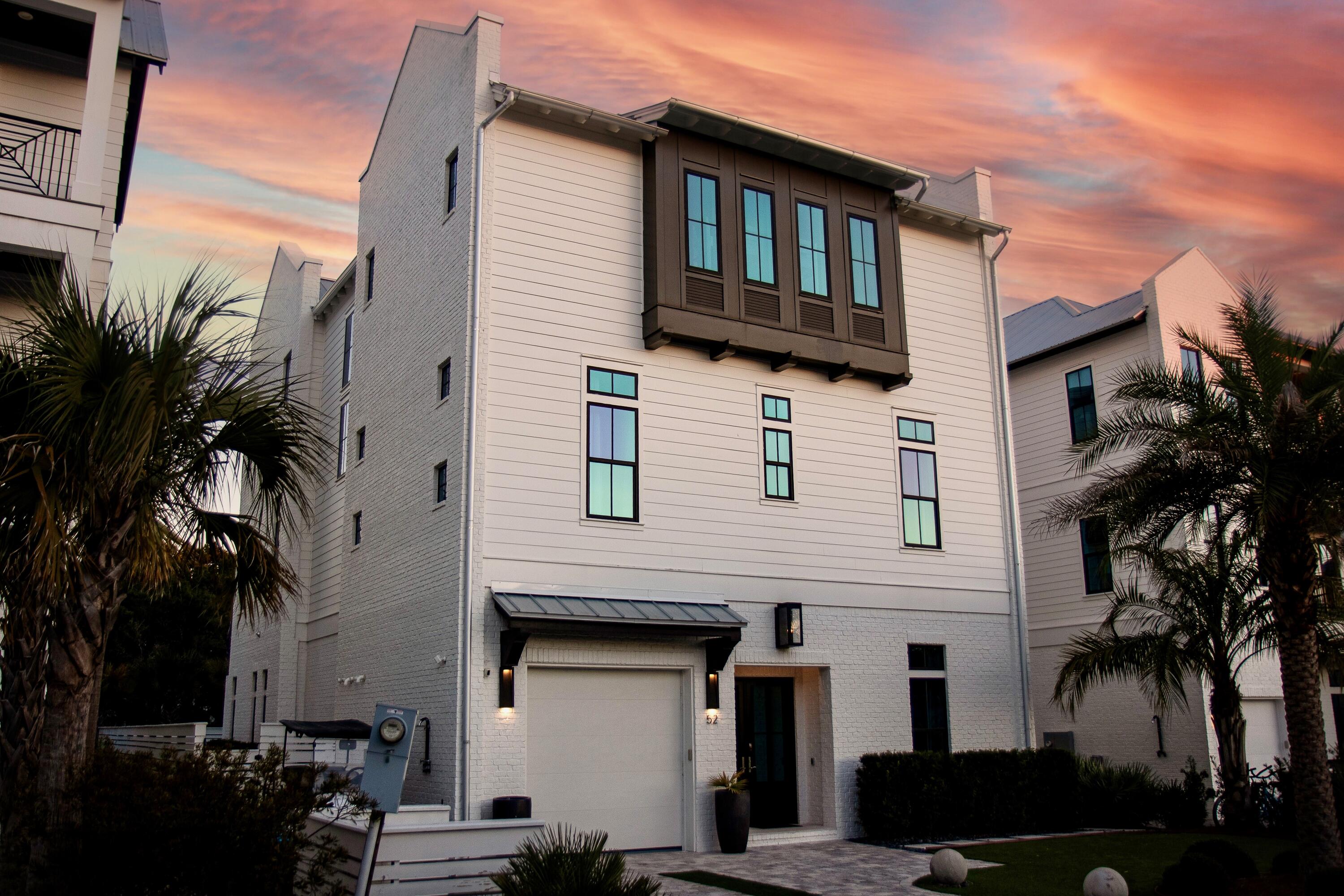 Attention investors: With $186k in rental income already on the books for 2026, 52 Seven Palms Drive presents a rare opportunity to own a refined coastal retreat in the heart of Inlet Beach. Located within the exclusive Seven Palms enclave--a boutique community of just five residences--the home is ideally positioned just a short stroll or three-minute bike ride to the upscale shops and dining of Rosemary Beach and 30Avenue. Enhancing its exceptional appeal, the property is located just one block from a beautiful  public beach access, allowing for effortless enjoyment of the pristine Gulf shoreline. Nestled near iconic Scenic Highway 30A, this luxurious seven-bedroom, nine-bathroom single-family residence offers an ideal blend of elegance, comfort, and coastal charm. Conveniently located just 15 minutes from Northwest Florida Beaches International Airport (ECP), the home provides seamless accessibility for both owners and guests.

From the moment you arrive, you'll be captivated by the home's impeccable craftsmanship and upscale finishes, including the added convenience of an attached garage. Inside, an open-concept design unfolds into a spacious living area, a window-lined dining space, and a chef-inspired gourmet kitchen featuring high-end appliances, expansive countertops, and custom cabinetryperfect for entertaining family and friends. Soaring cypress wood ceilings, rich hardwood floors, and timeless shiplap accents create a warm yet sophisticated ambiance throughout.

Each generously sized bedroom serves as a private retreat, complete with walk-in closets and spa-like en-suite bathrooms featuring walk-in showers. Multiple bunk rooms provide flexible sleeping arrangements, ideal for children, guests, or larger groups. A massive dining area stands out as a centerpiece of the home, impeccably suited for hosting large gatherings and memorable celebrations.

An elevator provides effortless access to all levels of the residence, including a dedicated media room designed for unforgettable movie nights. Multiple outdoor porches invite relaxation in the coastal breeze, while the private backyard oasis offers a sparkling, resort-style heated pool and a covered summer kitchen, perfect for dining and evening entertaining under the stars.

Whether seeking a primary residence, a luxurious vacation retreat, or a high-performing investment property, this exceptional home delivers on every level. Turn key ready and being sold fully furnished, it has $186,000 already on the books for 2026, offering immediate income potential alongside long-term appreciation. Ideally positioned to enjoy the best of 30A living, this remarkable residence seamlessly blends luxury, lifestyle, and proven rental performance at your fingertips.