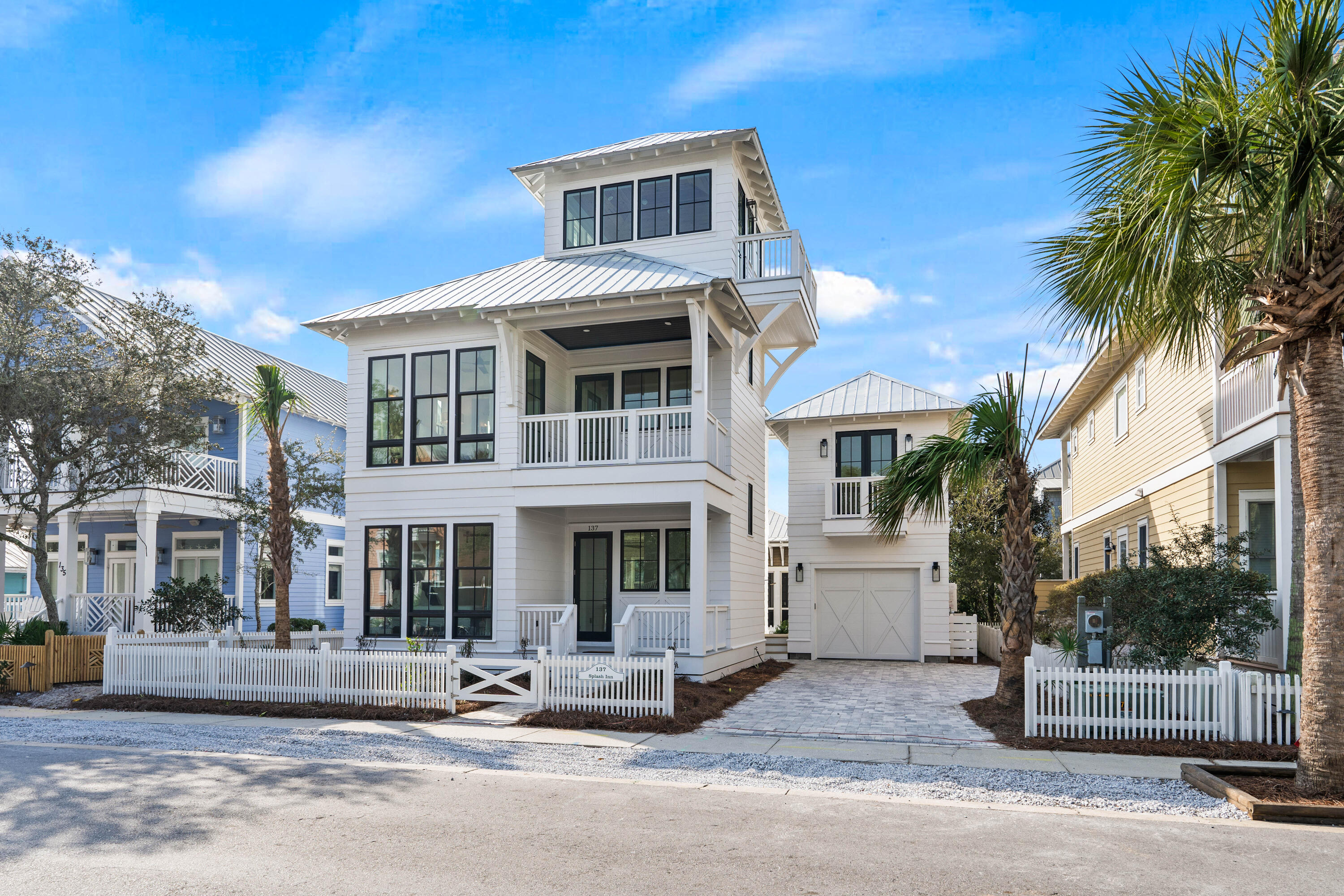 Construction Complete and Certificate of Occupancy Received!!! Don't miss your opportunity to own this BEAUTIFUL CUSTOM-BUILT HOME in the Highly Desired Carillon Beach Resort, one of the most popular family vacation beach retreat destinations on the Gulf Coast! This Spectacular Home is located just steps away from one of the three community pools and a short walk away from access to the sugary white sand beach and emerald Gulf waters. Whether you find yourself in the Gorgeous Main House or the separate Carriage House you will immediately feel yourself being absorbed by Coastal Luxury living. The main home features a Magnificent second floor Master Suite & Private Ensuite Bathroom where the Bedroom Area boasts a Customized Gorgeous tongue and groove pinewood elevated ceiling! There are two  additional Bedrooms on the first and second floors, each with its own Ensuite Private Bathroom. Main Living, Dining & Kitchen, along with a Half Bathroom are located on the first floor. And to Thoroughly Enjoy Spectacular Views, check out the Third Floor Tower Room bathed in Sunlight!!!! In the Carriage House you will find a separate private living space, with its own Kitchenette, Bedroom, Full Bathroom & Living Space. You will find stylish flooring, tile and cabinetry all through this thoughtfully designed home. There is also space in the backyard to add a private pool. And for anyone not familiar, Carillon Beach is a secluded, private, gated-community with a private beach, three community swimming pools, basketball court, tennis courts, children's playground, restaurants and shopping. The amazing restaurants, entertainment of 30A and Rosemary Beach are only a 5-minute drive West and if you want to venture East it's only a 10 15-minute ride to Pier Park & Aaron Bessant Park in Panama City Beach. So, plan your visit today! All dimensions are approximate and should be verified if important.