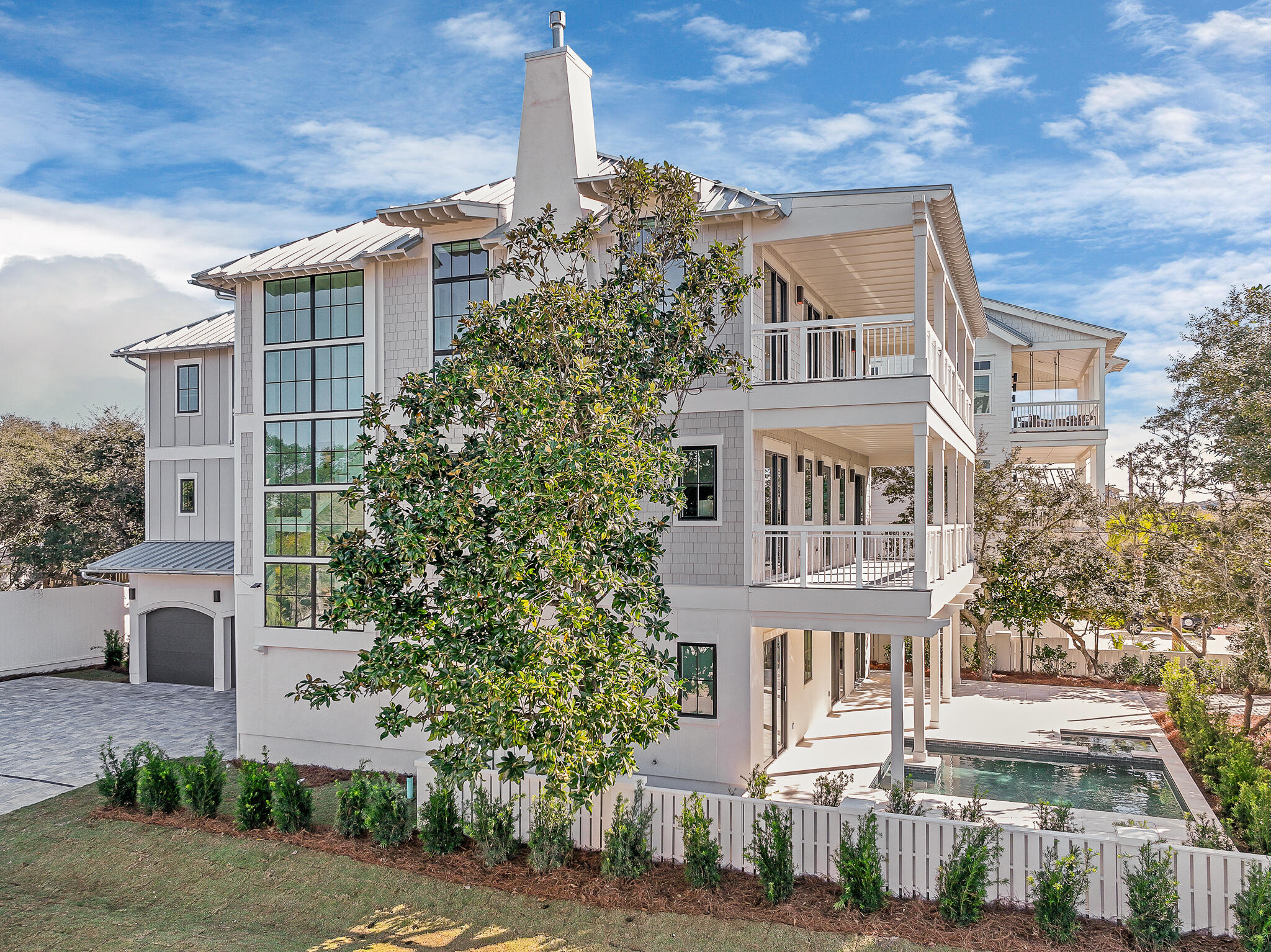 Sea Sunsets, the newest landmark home on renowned Scenic Highway 30A in South Walton, is an ode to the idyllic beach vacation getaway.  The home has been elegantly prepared and fully furnished by a professional interior design team.  Its light-filled space and thoughtful design embraces the beach from every vantage point, even while effortlessly handling the logistics of gatherings, privacy and vehicle parking.  An up-to-date take on a classic beach home design, its clean lines are defined by time-tested coastal architecture: high ceilings; cool, solid surface flooring; and plenty of outdoor space.  Sea Sunsets is built to standards of the latest construction science, elegant yet strong.  No feature or convenience was overlooked in the construction and design. A ground­ floor bedroom and family room which graciously flows onto the outdoor pool deck provide the convenience families and guests desire. Multiple bedrooms and baths are matched by substantial living and dining spaces.  Two floors of spacious balconies with stunning views add to the beach house vibe, and the heated pool is destined to be the spot youngsters hang out while dinner is cooking on the grill.   No feature or convenience was overlooked in the construction and design of this fabulous new home.  With rental projections of $400,000 annually, Sea Sunsets could be an extremely desirable investment property.  One of the greatest features of this new home is the ample space dedicated to parking...a three car enclosed garage combined with overflow parking for seven additional vehicles makes this home a special location for family gatherings at the beach!  Call today to schedule your private tour of this new, luxurious 30A beach residence.