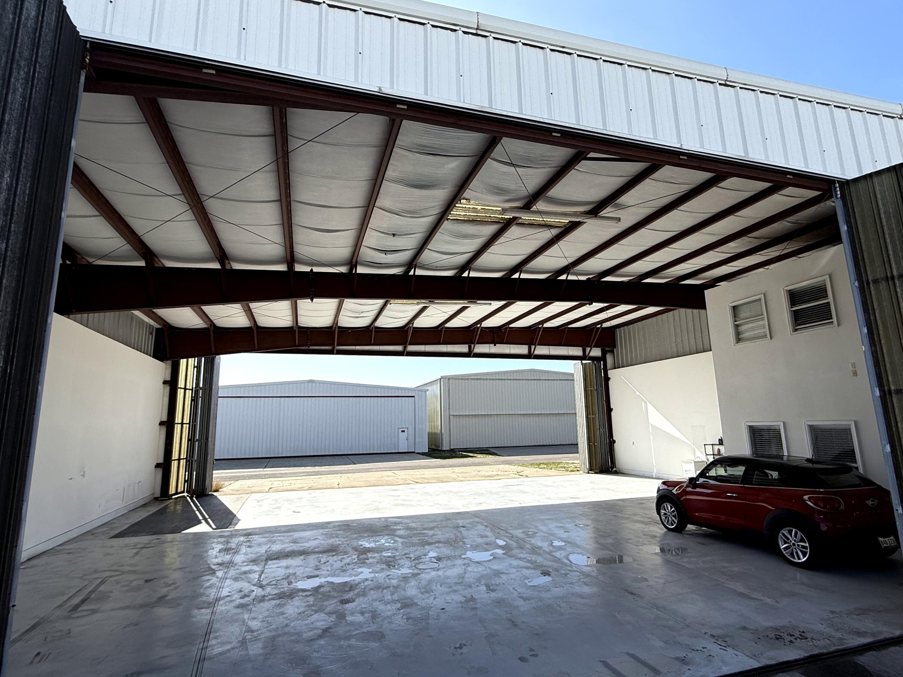 Protect your plane in this fantastic airplane hangar at Destin Executive Airport! Pristine space to park your plane and vehicles. Hangar is 3,116 sq ft at approx. 58ft wide and 50ft deep with both front and rear doors measuring approx. 56ft wide and 16ft tall. Conveniently integrated inside the hangar, the two-story office space measures approx 16'x12' on each floor and currently features a well-appointed ground-floor workspace and an upstairs bedroom and bath, creating the perfect blend of productivity and relaxation between flights. Ground Lease with Okaloosa County is until 5/17/2033. 2025 Ground Lease (10/1/25 - 9/30/26) payment of $6,397.89 has been paid. All ground leases are adjusted annually to reflect increases in the Consumer Price Index based on a 12-month September through August average.

Located in the heart of the Emerald Coast, Destin Executive Airport serves as an essential transportation hub for Okaloosa County, offering a 5,000-foot runway, full-service general aviation amenities, and unmatched proximity to the South's most beautiful beaches, renowned golf courses, and world-class fishing. Atlantic Aviation, the airport's full-service Fixed-Base Operator, provides 100LL and Jet A fuel along with premier conveniences including 24-hour surveillance and security, concierge services, a pilot's lounge, snooze rooms, showers, Wi-Fi, crew cars, Go Rentals, and a conference room. With its close proximity to Destin and first-class facilities, Destin Executive Airport offers both convenience and privacy for private-jet owners.

This purchase is for an assignment of ground lease and must be approved by the Okaloosa County Airport Authority. Buyer to confirm all measurements and information they deem important.