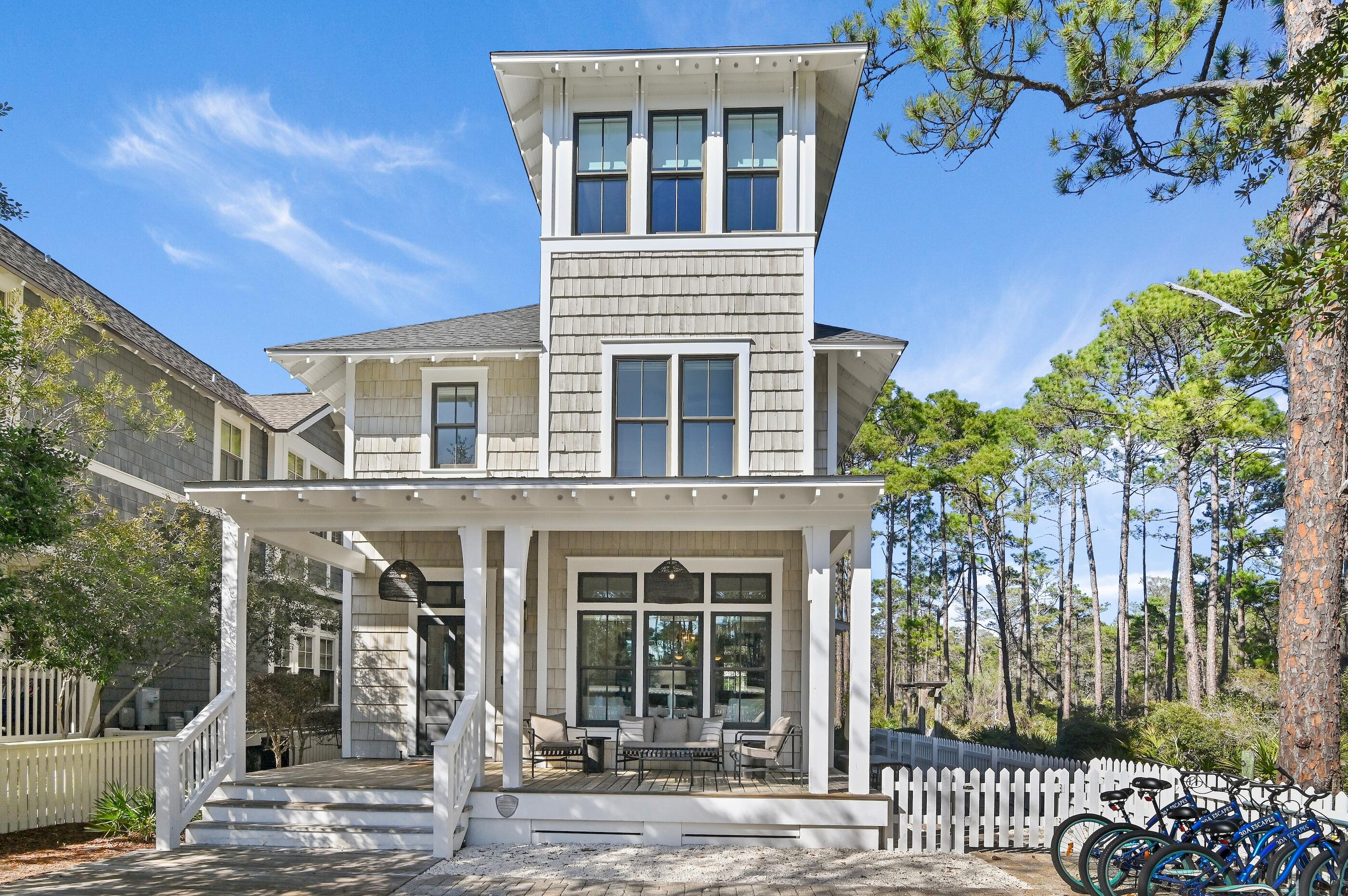 Discover the perfect blend of luxury and coastal living at this stunning home in the sought-after Watersound West Beach community. Nestled along the serene border of Deer Lake State Park, this residence offers a peaceful backdrop of natural beauty adjacent to scenic walking trails leading to the beach.
Just steps from the community pool and the beach boardwalk, enjoy effortless access to sugar-white sands and the turquoise waters of the Gulf with no crowds! The open-concept design features spacious living areas, ideal for entertaining or relaxing after a day at the beach.  Custom features include true wide planked hardwood flooring, luxury appliances, hand-selected fixtures, as well as extensive wainscoting and wood trim work throughout. Offered fully furnished, this well thought out floor plan showcases an open concept living space on the main level with expansive state park views, a spacious master suite, 2 guest bedrooms suites, a private bunk room plus another bunk space tucked under the stairs, and a third floor den with gulf views that can double as a 4th bedroom. Plenty of storage can be found throughout the home and there is a home office on the main level. High end luxury finishes, generous porches, and serene outdoor spaces make this home an inviting coastal retreat. With exclusive access to Watersound West Beach amenities, including heated & cooled community pool, multiple parks, trails and boardwalks, manned security gate, fitness center, and private boardwalk to the BEACH with bike parking, this home offers the ultimate 30A lifestyle. Home is located on the most exclusive lot in the neighborhood, so don't miss your chance to own this piece of paradise perfectly positioned in a serene natural setting yet convenient to all 30A has to offer!