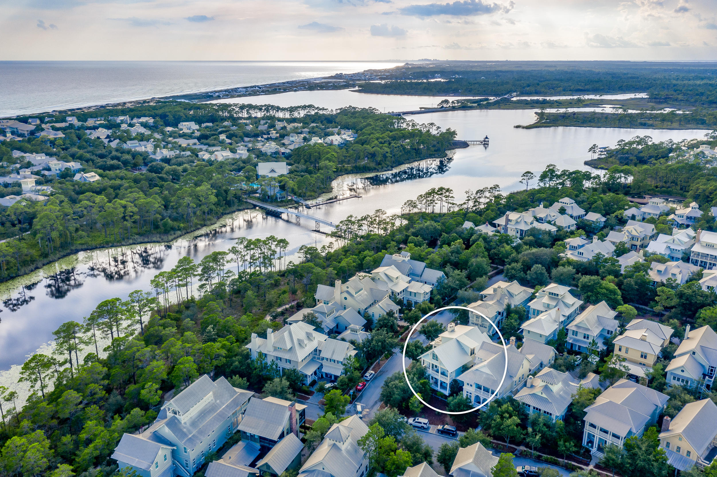 Sunlight streams through the gorgeous open spaces of this 5BR/5.5 BA WaterColor retreat conveniently located just steps from the Phase III pedestrian bridge for easy access to community amenities such as the BoatHouse, the newly expanded WaterColor Beach Club and the Phase III Frog Pool. A custom collaboration between Thurber Architecture and Barbara Jordan Interiors, crisp coastal design with soothing neutrals carries throughout the home with desirable features such as shiplap walls, warm toned hardwood floors, barn doors, designer lighting, beautiful tiled bathrooms, surround sound, Rinnai tankless water heaters and much more. The open concept living and dining area is highlighted by a lovely gas fireplace with driftwood mantle and built-in surrounds. The fully equipped kitchen includes commercial grade appliances, quartz countertops, a center island with seating and custom cabinetry. Multiple covered porches are found on the first and second levels of the home including an expansive porch with fireplace directly off the living area. The serene second floor master suite features a spacious ensuite with soaker tub and walk-in shower, and direct access to a covered porch. Find two comfortable guest suites with private bathrooms on the first level along with a secondary living room area with an adjacent bunk room with four built-in bunks and a private bathroom. The third floor includes an additional guest suite, a wet bar and an open-air balcony with beautiful lake and community views. A covered carport with storage along with ample driveway space for four cars makes parking a breeze while an outdoor shower provides easy clean-up after a day at the beach. This immaculate property is offered furnished and move-in or rental ready.

Located on 499 acres in the renowned South Walton beaches, WaterColor was created with families in mind and offers the charm of small-town life. Exceptional community amenities include six beautiful swimming pools, a Gulf front beach club, nature trails, a Boathouse offering kayaking, canoeing and paddle boarding, a fitness center, outstanding tennis facility, Camp WaterColor for kids with lazy river and waterslide, parks and green spaces.